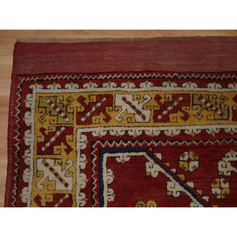 Antique Turkish Bergama rug of classic design with superb colour including a very good yellow. The rug is of a traditional design from this region.

The rug has very soft wool and a very floppy handle.

The rug retains original long kilim at