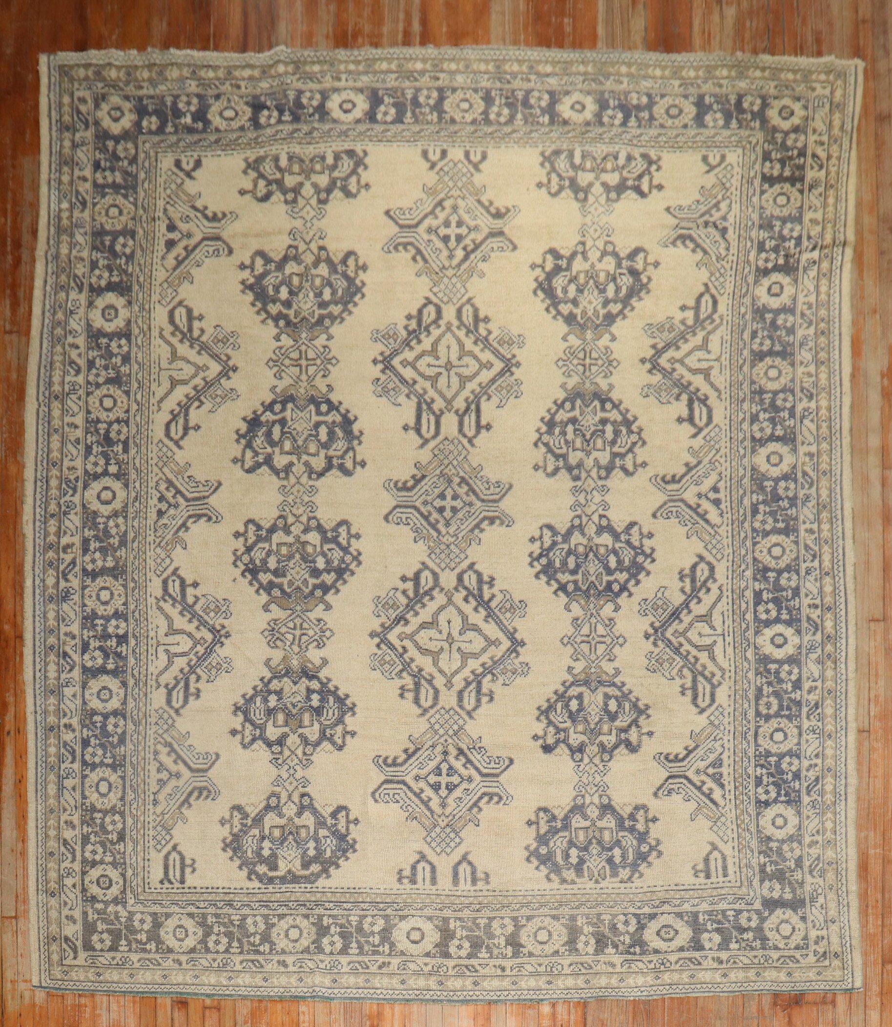An early 20th-century square room-size Turkish Oushak rug with a bluecrab motif on a neutral color field

Measures: 10'1'' x 12'5