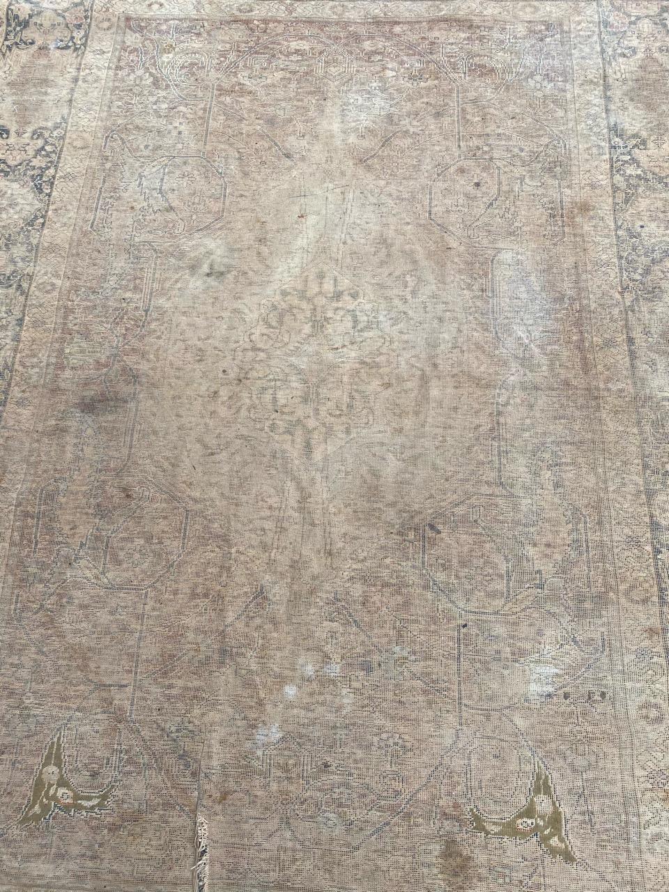 Very beautiful late 19th century Turkish distressed rug with beautiful floral design and nice colors, entirely hand knotted with wool on cotton foundation. Wears.