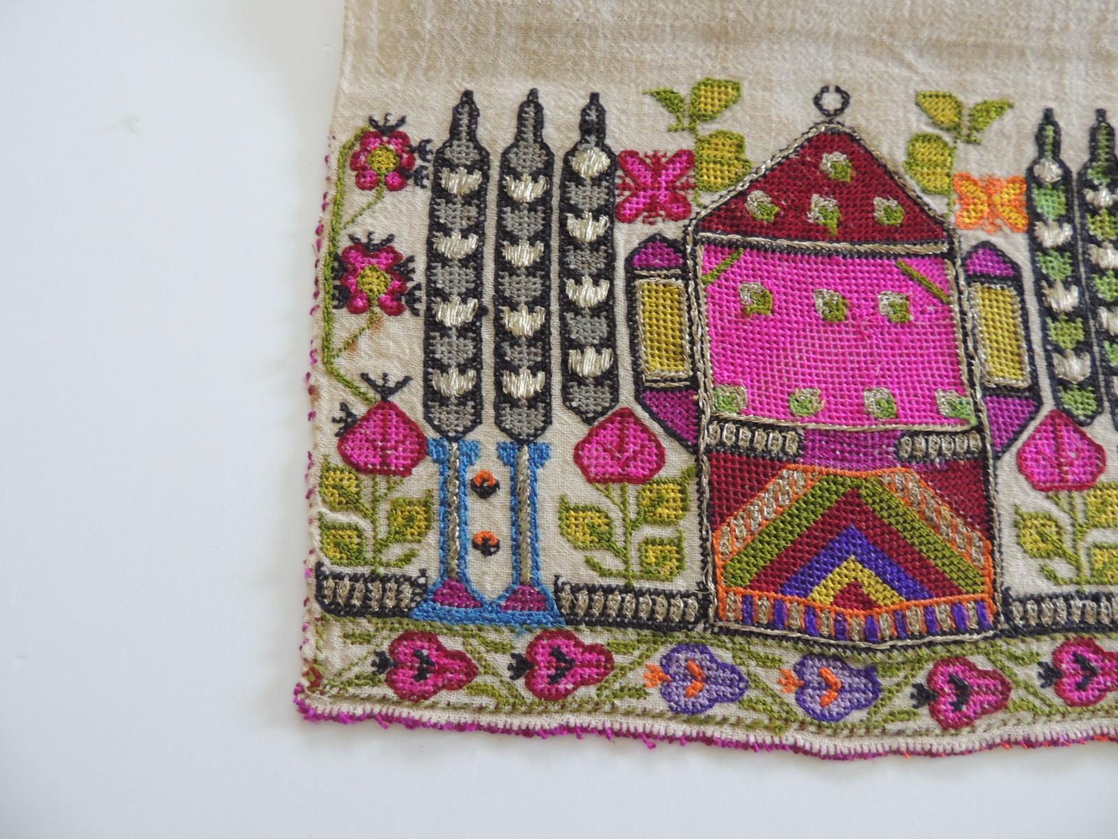 Antique Turkish embroidered colorful textile.
Heavy metallic threads and silk embroidered on linen.
In shades of red, blue, green, purple, orange and fuschia.
The embroidered part is 15.5