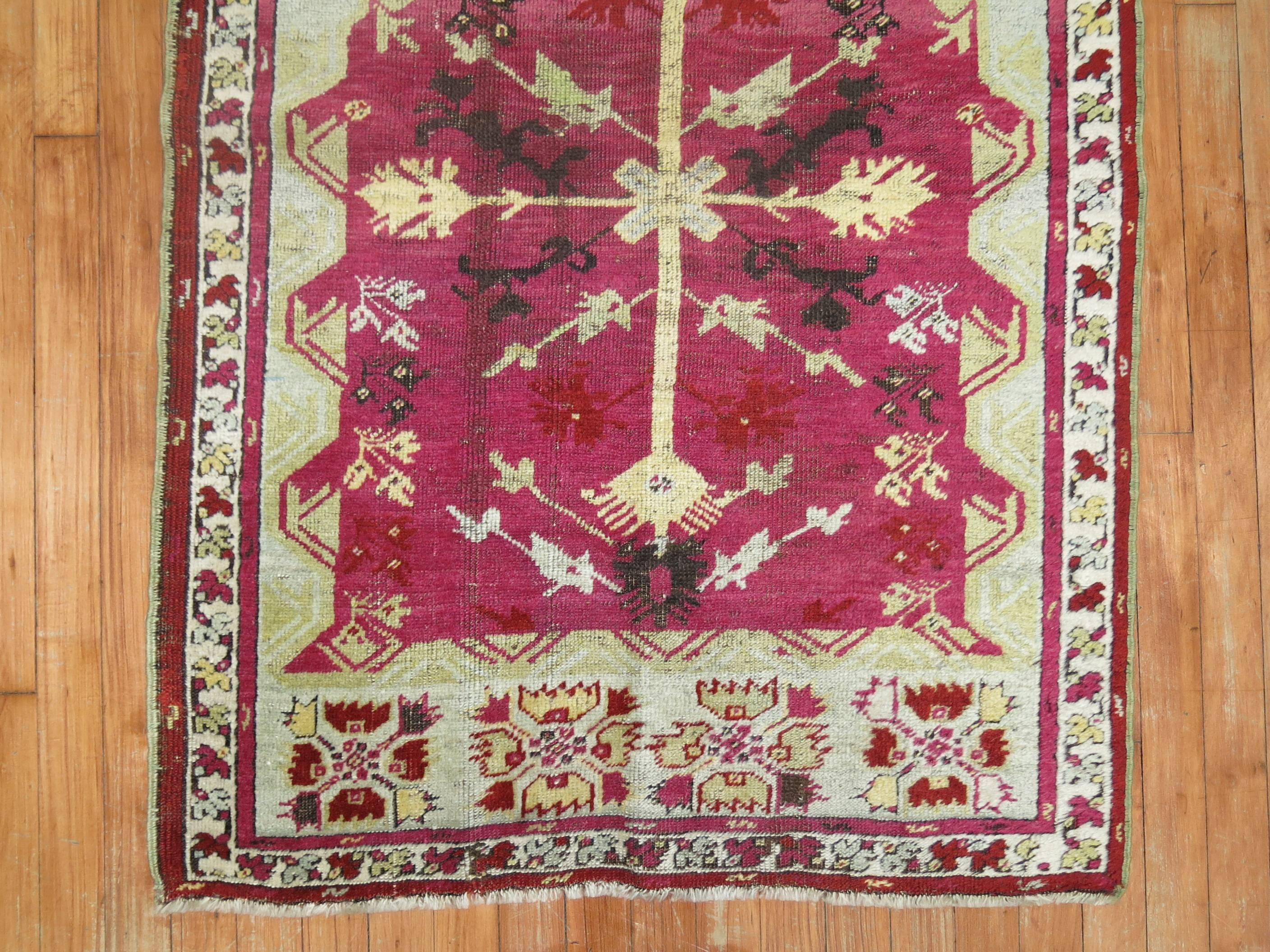 A one of a kind decorative Turkish Ghiordes rug with a prayer niche motif.