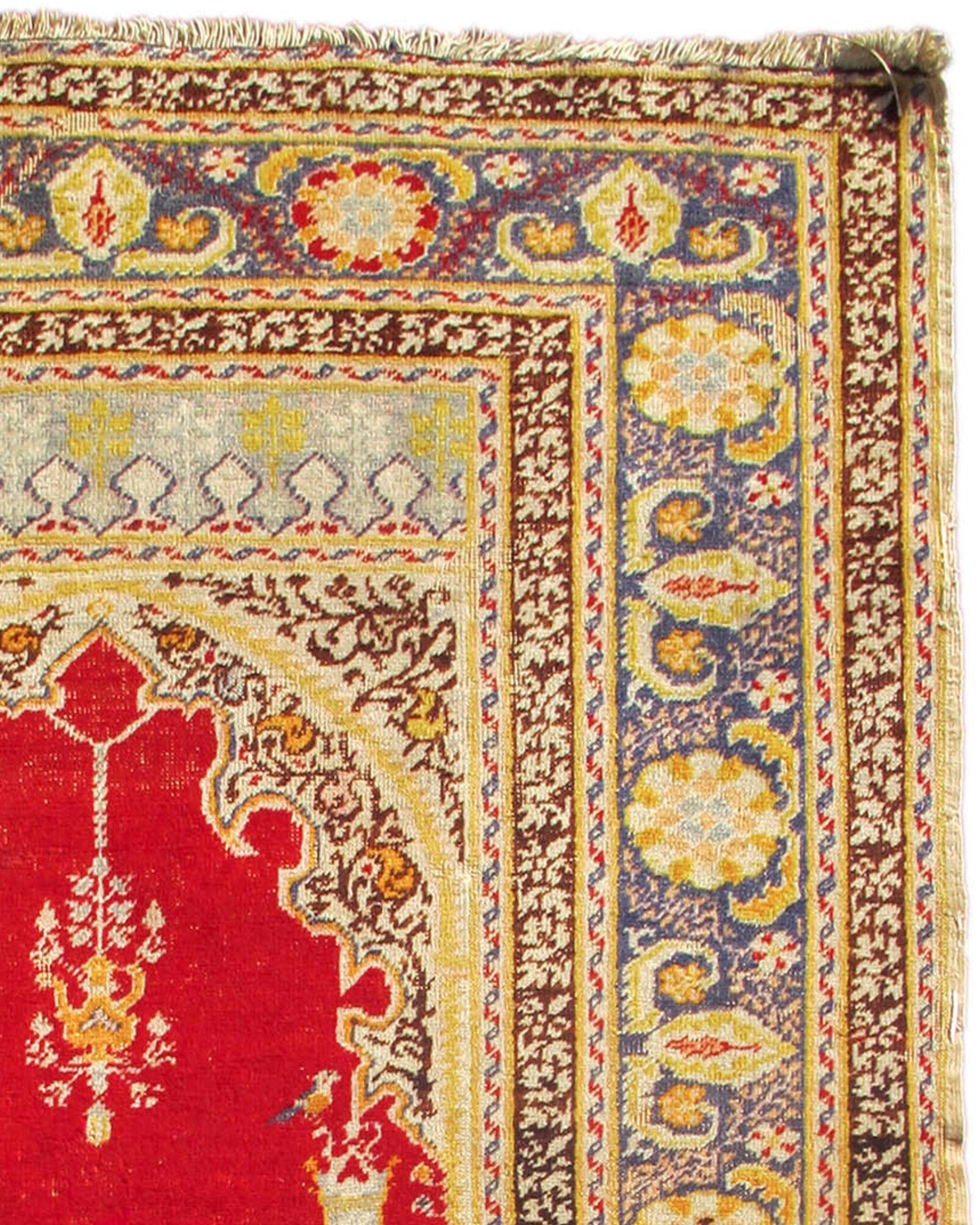 Antique Turkish Ghiordes Prayer Rug, Late 19th Century

Ghiordes prayer rugs are a type of prayer rug that originated in the town of Ghiordes, which is now in Turkey. They are known for their angular prayer niches and are considered to be among the