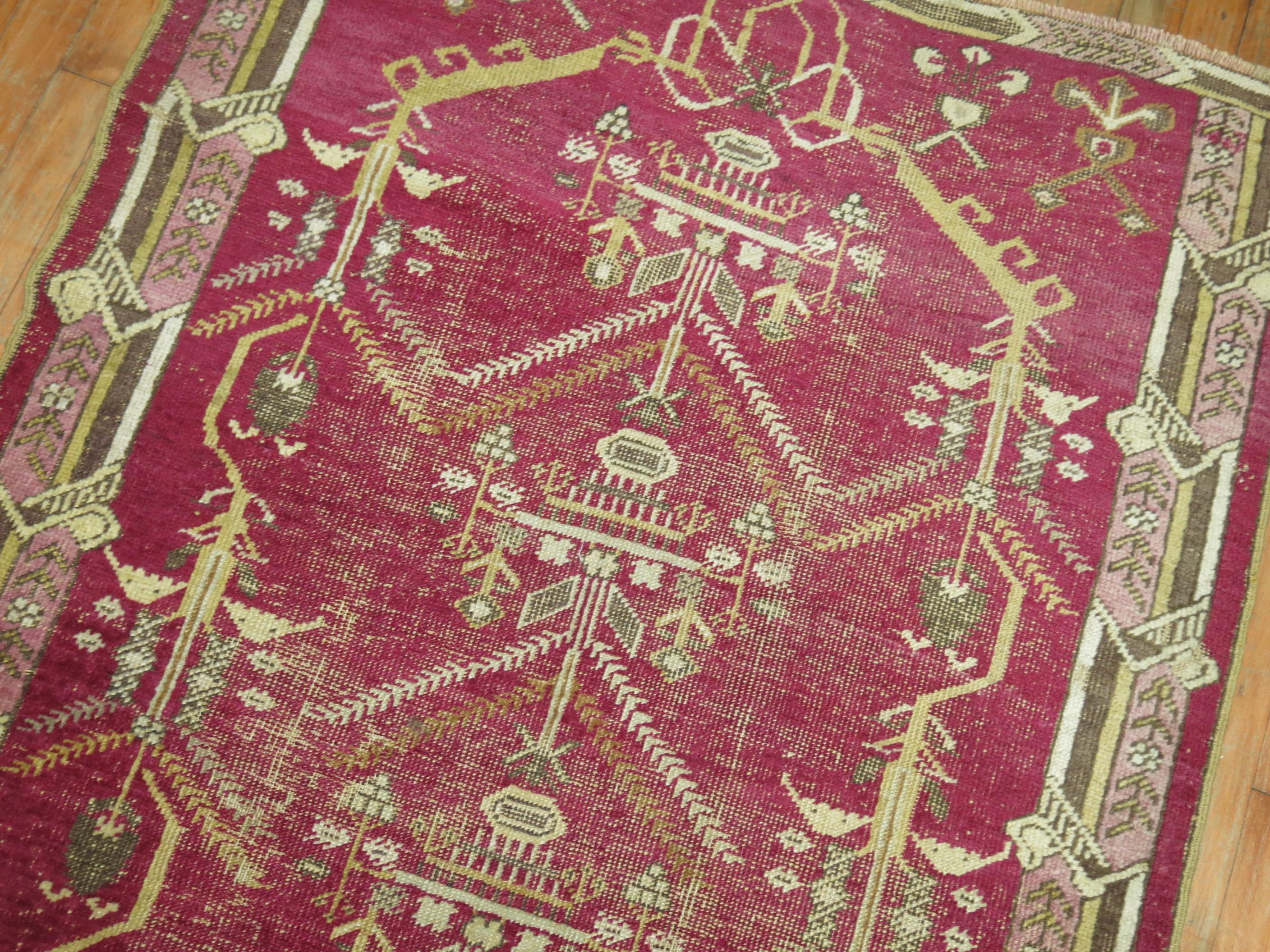 A one of a kind antique decorative Turkish Ghiordes rug.