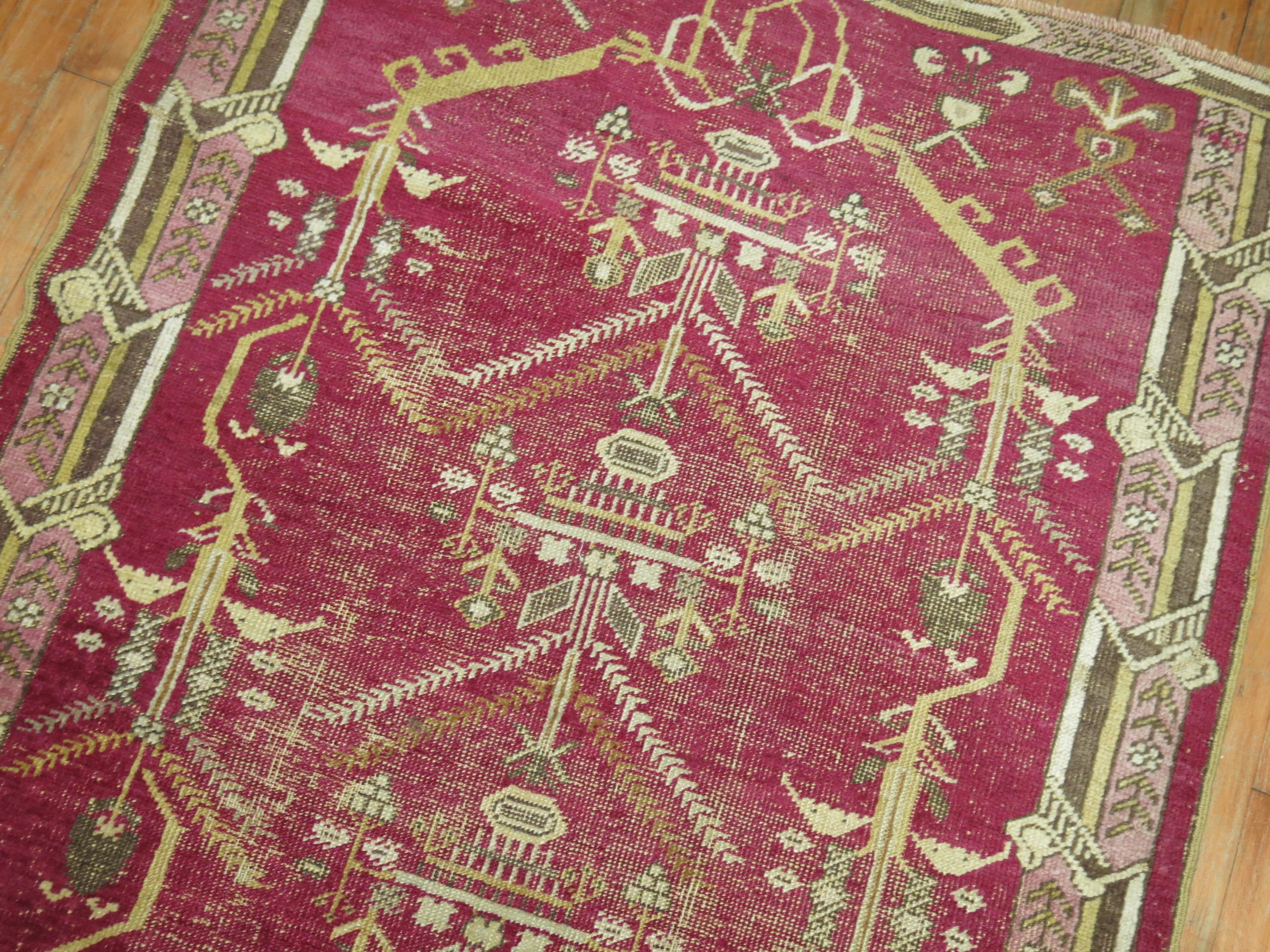 A one of a kind antique decorative Turkish Ghiordes rug.