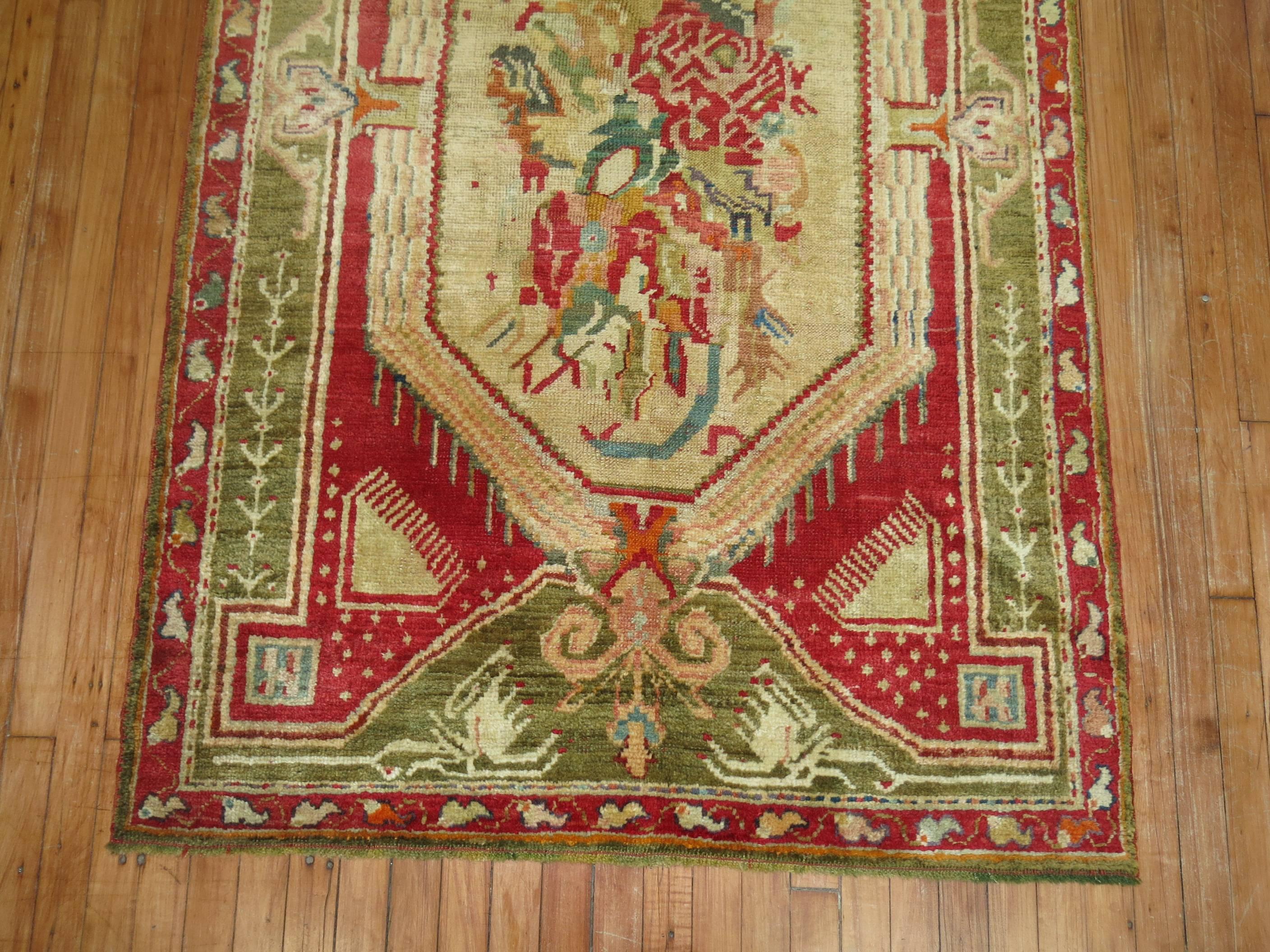 A full pile vibrant colored Turkish Ghiordes rug from the early stages of the 20th century.

3'11'' x 6'