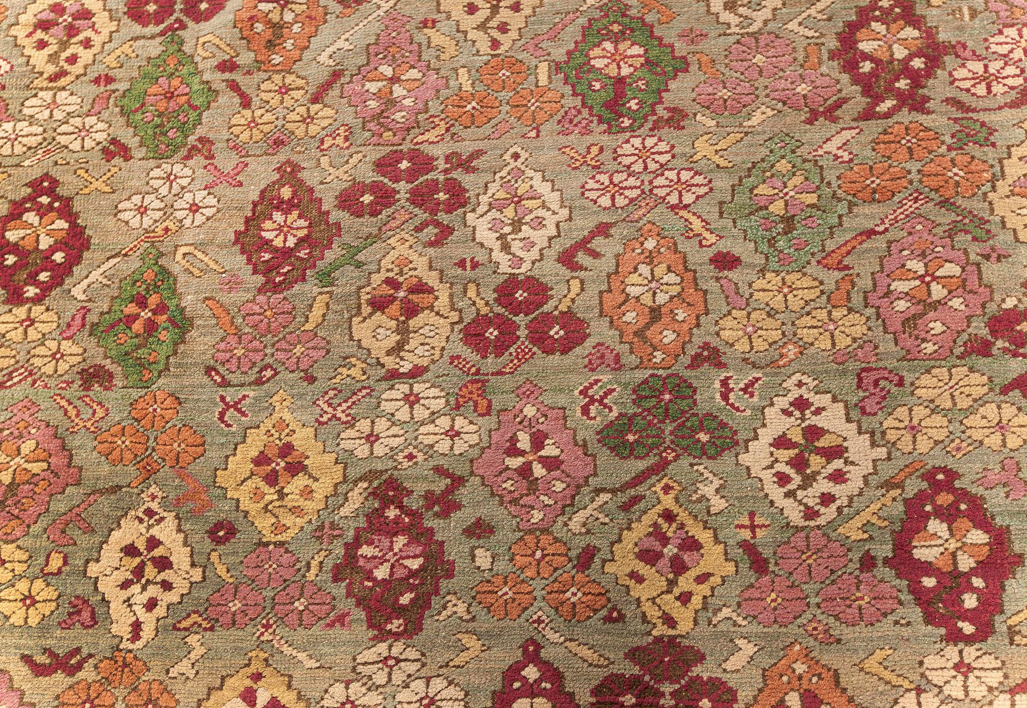 Antique Turkish Ghiordes beige, green, orange, pink, red rug 'size adjusted'
Size: 10'5