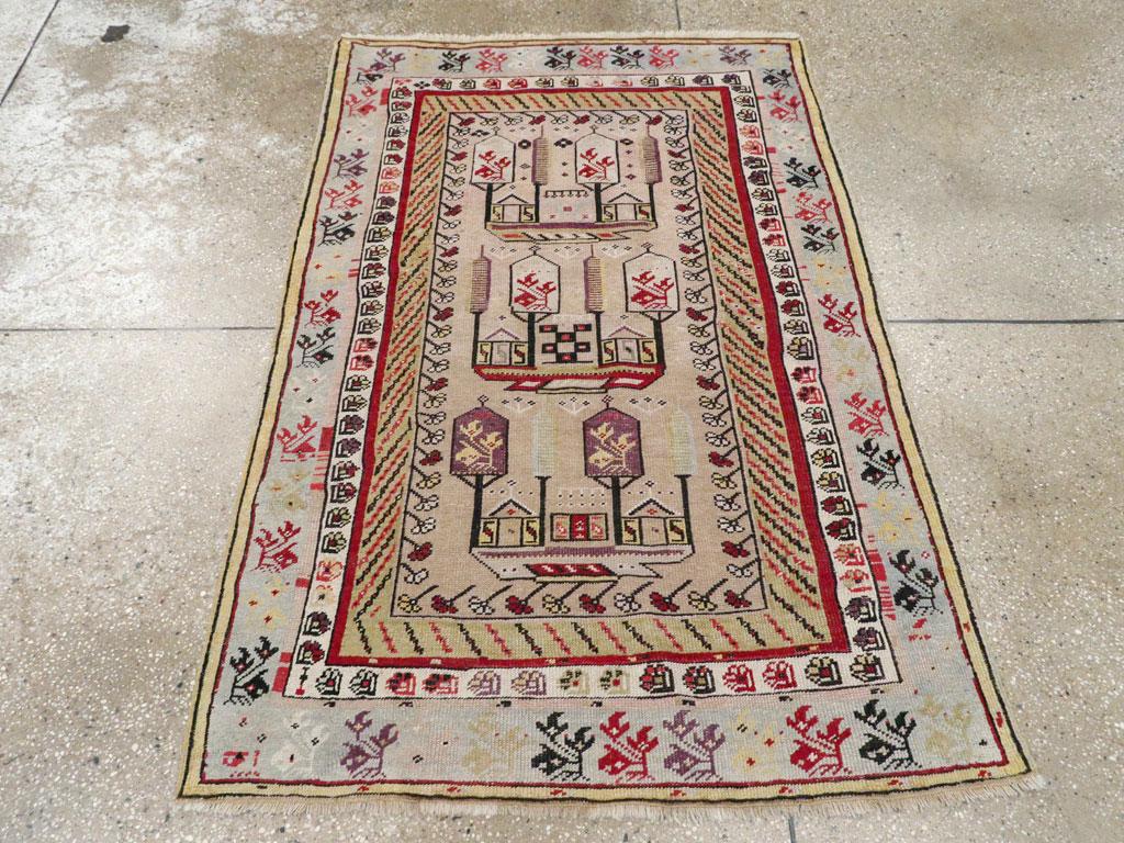 Hand-Knotted Antique Turkish Ghiordes Small Rug With Shades of Grey-Blue, Purple, and Beige For Sale
