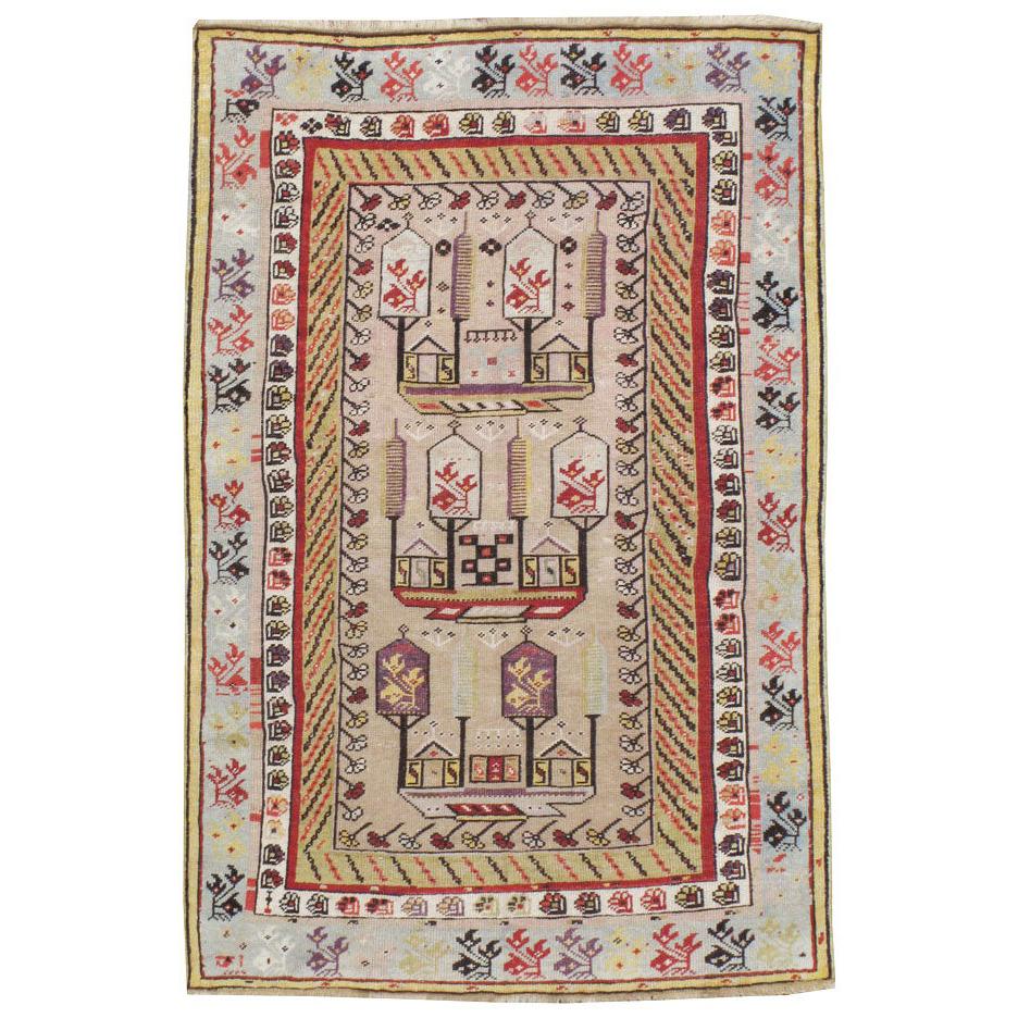 Antique Turkish Ghiordes Small Rug With Shades of Grey-Blue, Purple, and Beige For Sale