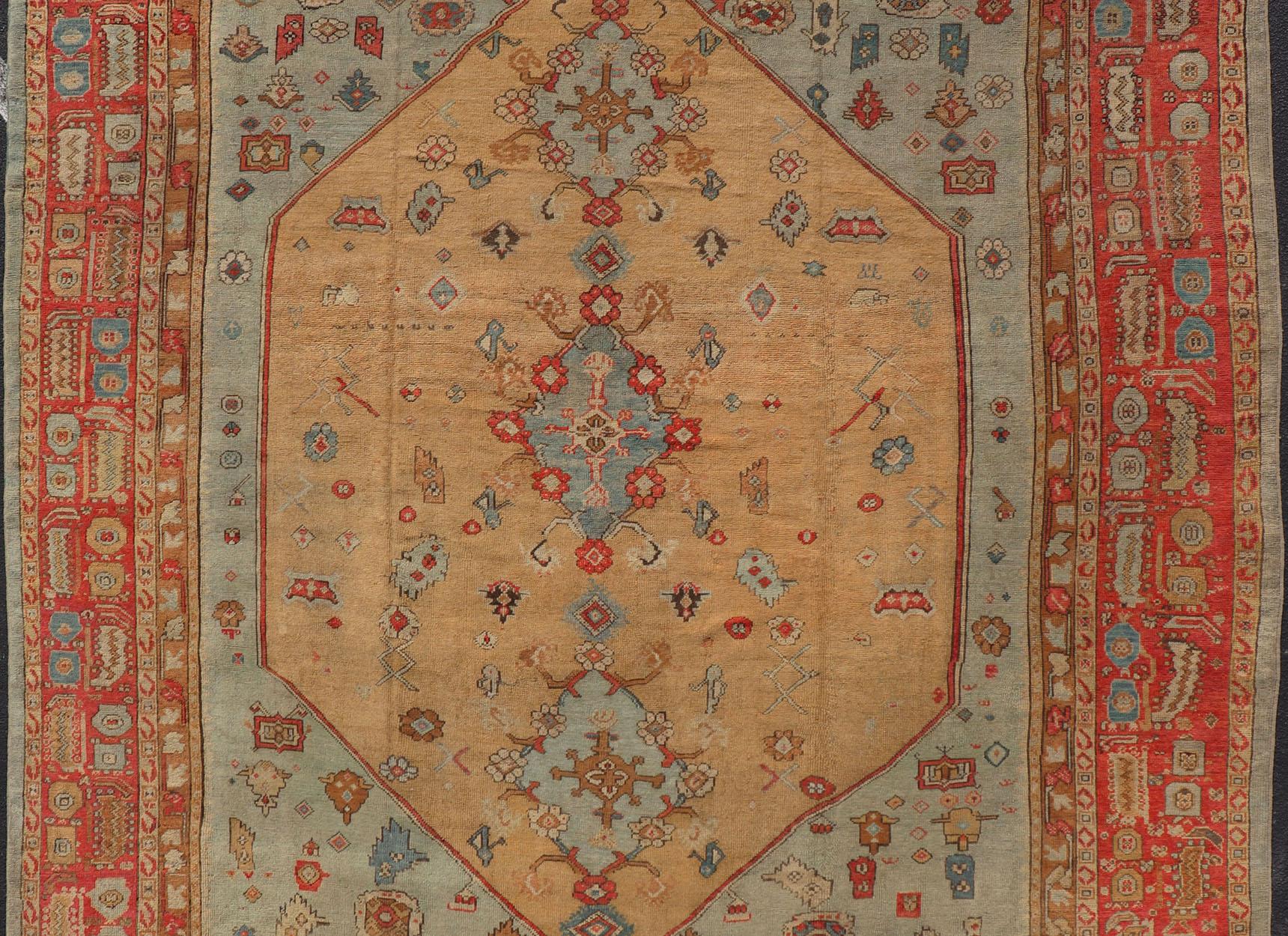 Antique Turkish Ghoirdes Oushak Rug With Medallion in Sky Blue, Tan, and Red. Keivan Woven Arts / Rug / S12-0308 / country of origin / type: Turkey / Oushak, circa 1880. Antique oushak, Turkish oushak, Turkish Ghoirdes.
Measures: 12.2 x