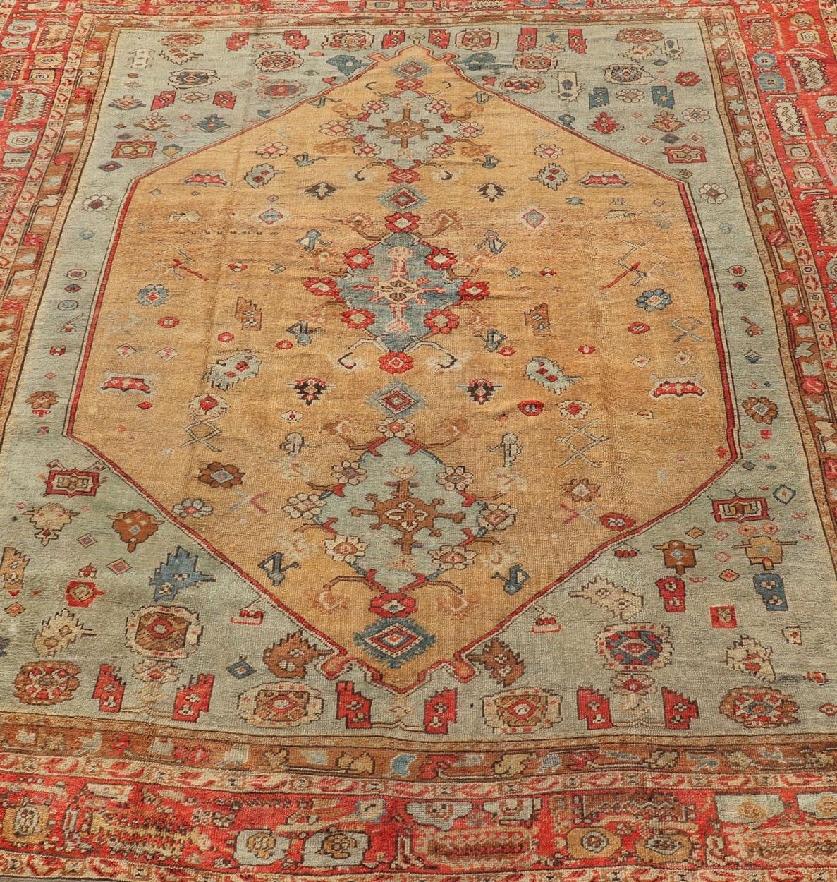 Antique Turkish Ghoirdes Oushak Rug With Medallion in Sky Blue, Tan, and Red For Sale 1