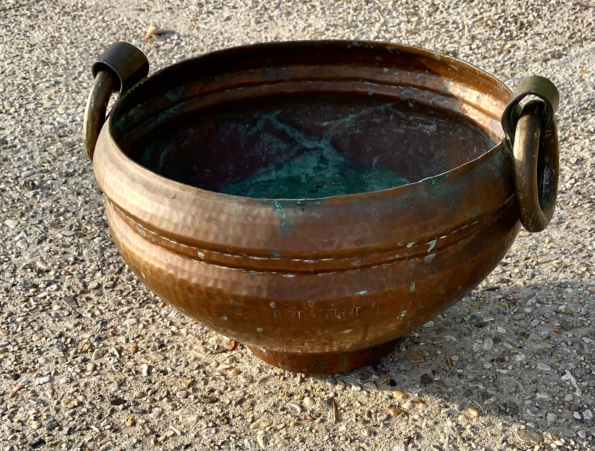 A 1920's hand hammered Turkish tribal, copper, iron and brass water pot. In original condition, non-altered with an old outstanding patina and color. Beautiful time worn Verdigris in the interior. Heavy and solid.

Rich texture for decorating your