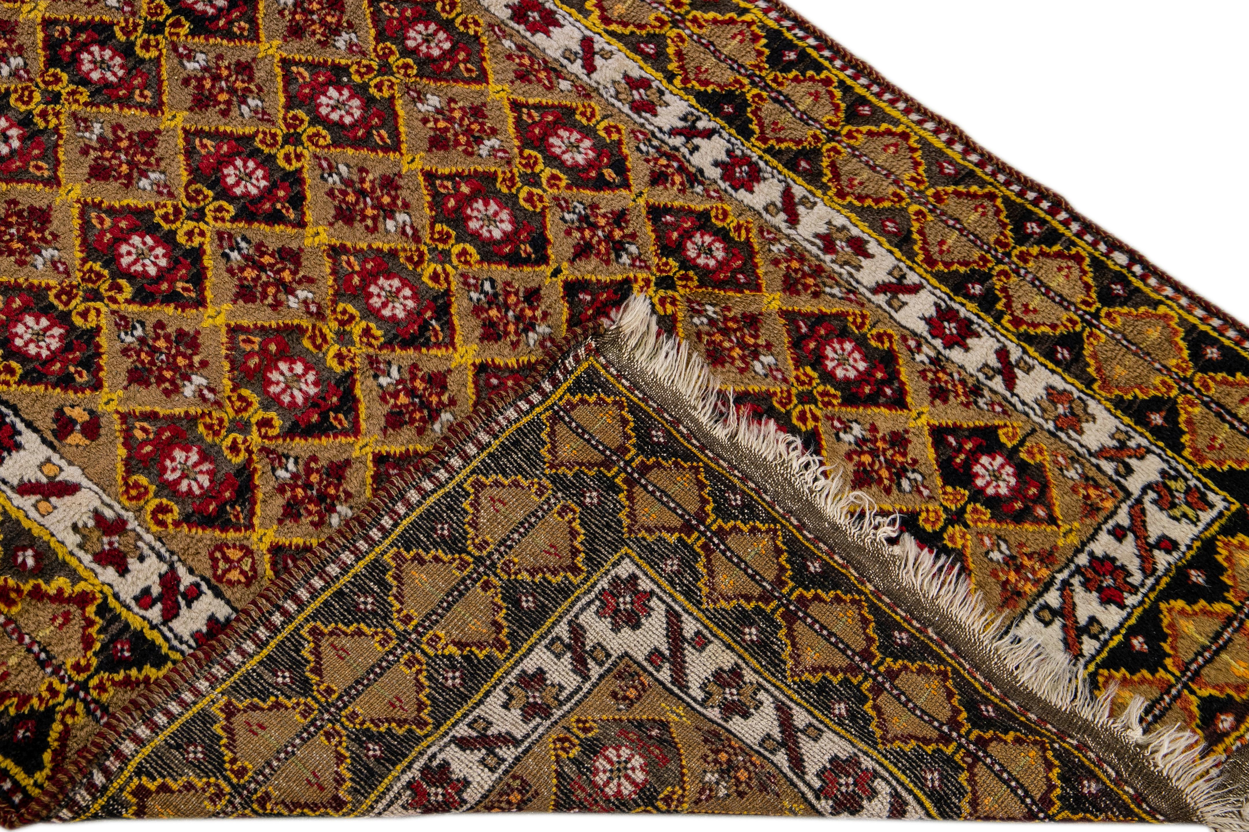 Antique Turkish hand-knotted wool runner with the brown sienna field. This piece has red, yellow, and brown accents in an all-over geometric floral design.
 
This rug measures: 3' x 10'.