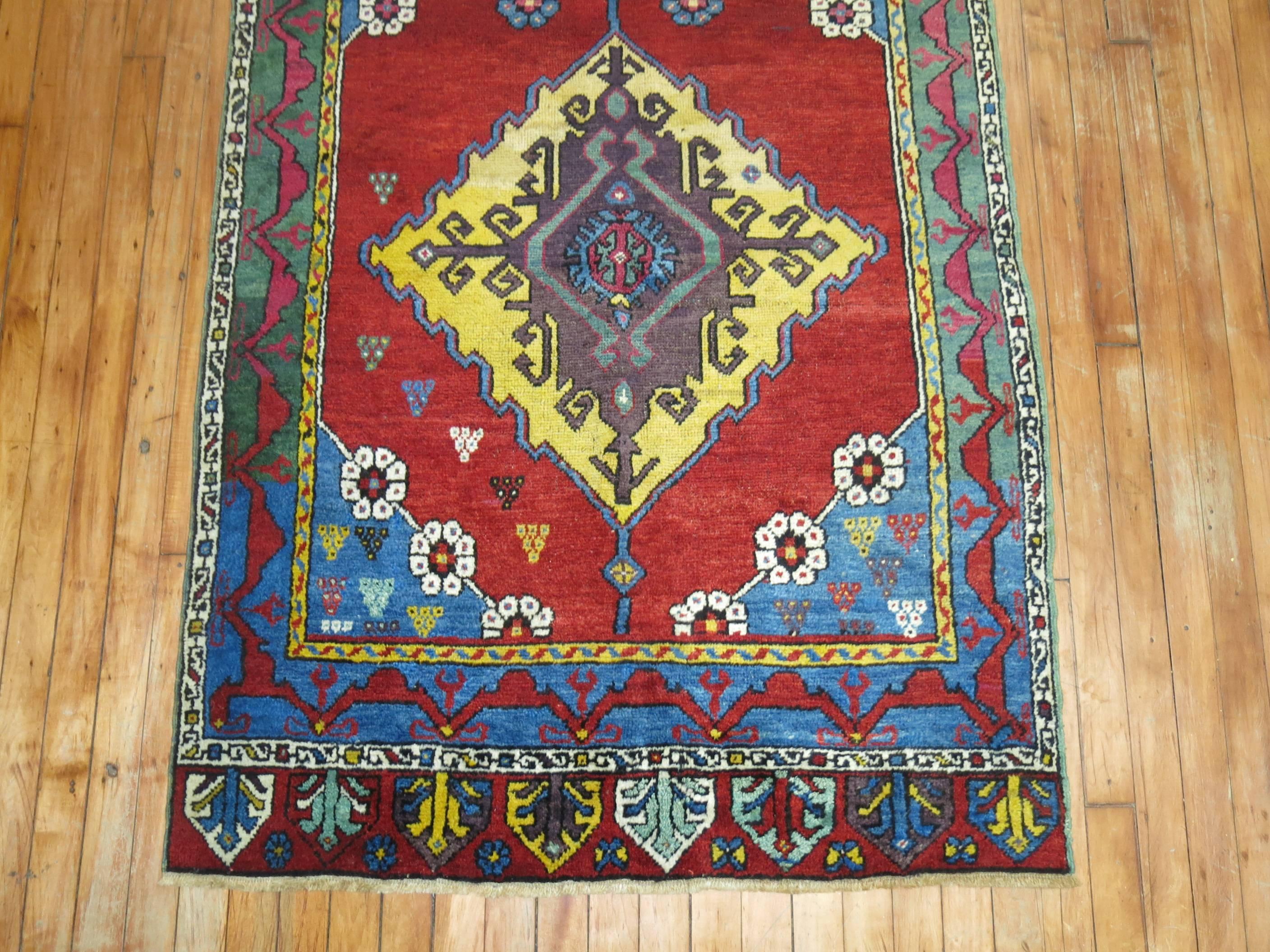 Stunning early 20th century Turkish Karapinar runner with rich colors.

Antique Turkish Karapinar rugs are very rare and are among the more intriguing examples, boasting a very distinct set of design preferences that makes them reminiscent of