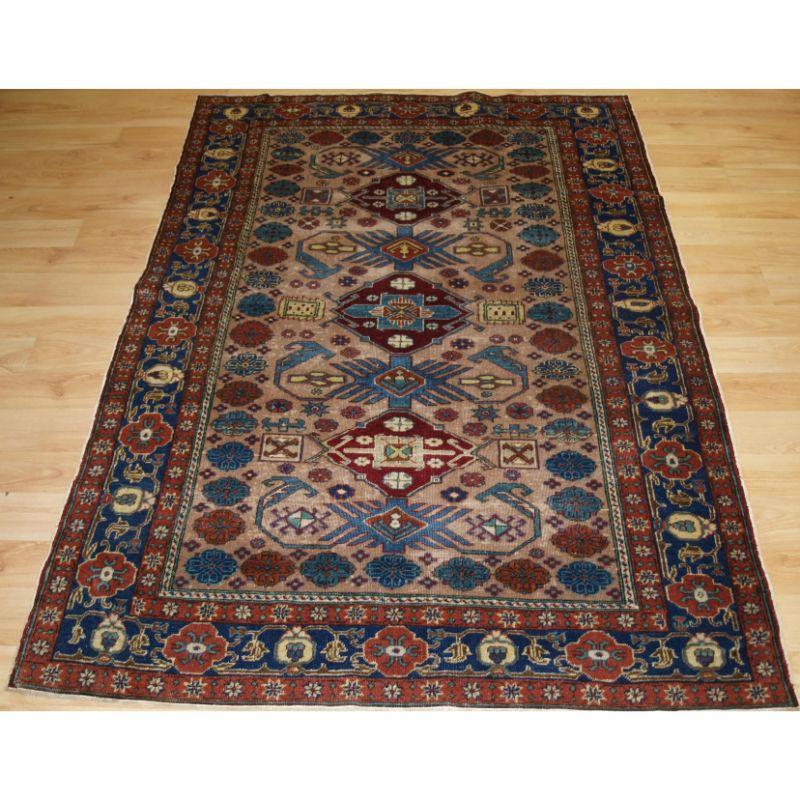Antique Turkish Kayseri rug with traditional Caucasian 'Kuba' region design.

The rug has a classic Caucasian design on a very soft ground colour with the design in light indigo blue and burgundy. The border design is very well drawn.

The rug