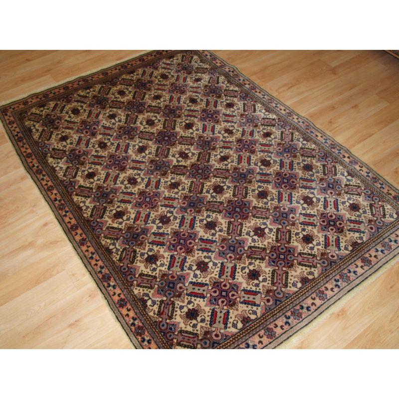 Antique Turkish Kayseri rug with traditional lattice design.

The rug has a lattice design on a very soft ground colour with the design in blues, reds and purple. The border design is very well drawn.

The rug is in good condition with slight