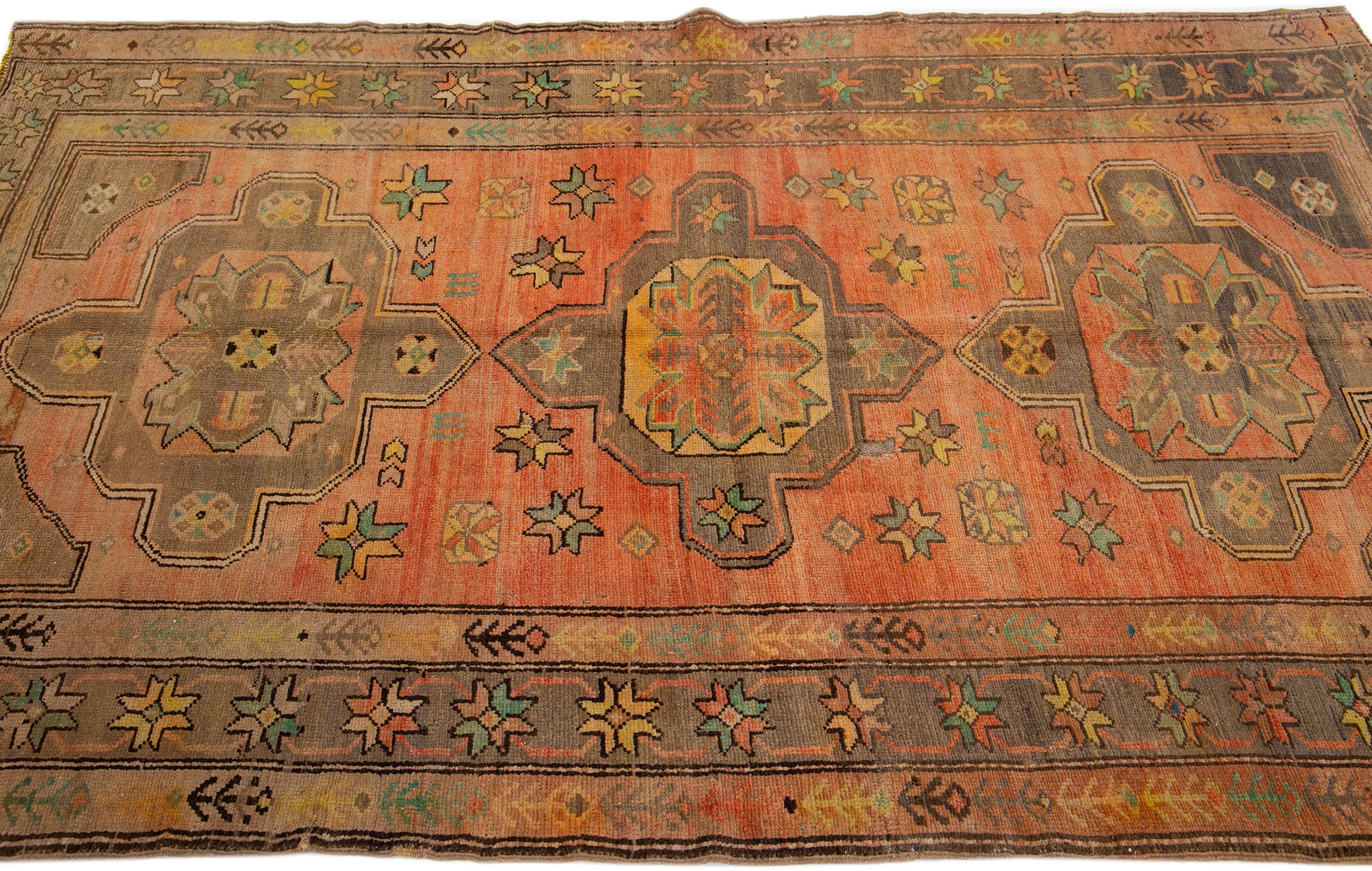 Antique Turkish Khotan Handmade Wool Rug with Tribal Terracotta Field In Good Condition For Sale In Norwalk, CT