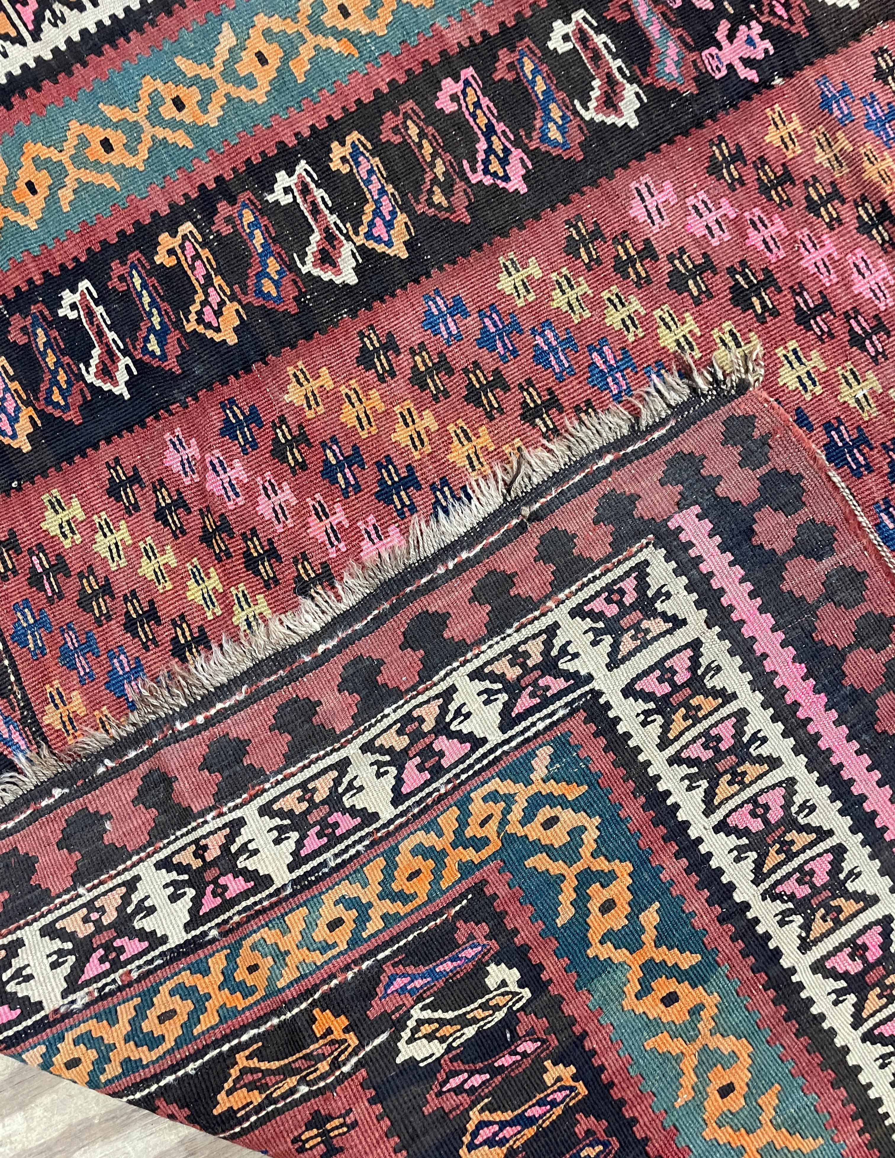 Discover the Exquisite Beauty of Antique Kurdish Kilims

Step into the world of timeless elegance with our Antique Kurdish Kilim, boasting a stunning size of 5'6