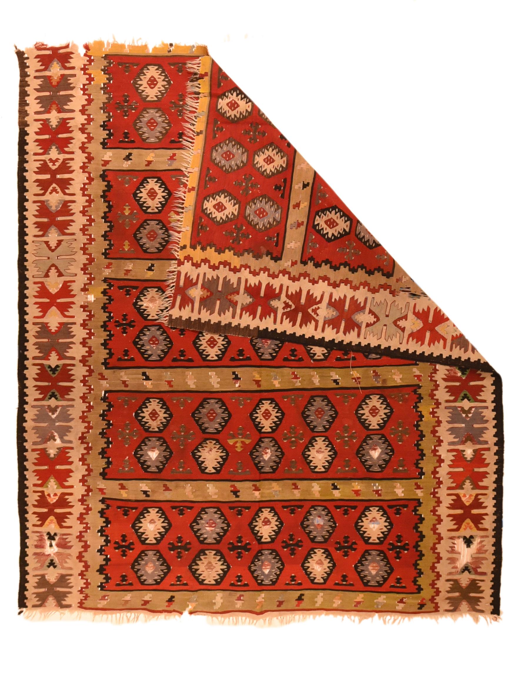 Antique Turkish Kilim rug measures 4'5'' x 5'4''. Now much reduced at each end, this Anatolian flatweave in the slit tapestry technique shows five red panels, each with two rows of hexagons enclosing ashiks. Ivory border with geometric paired