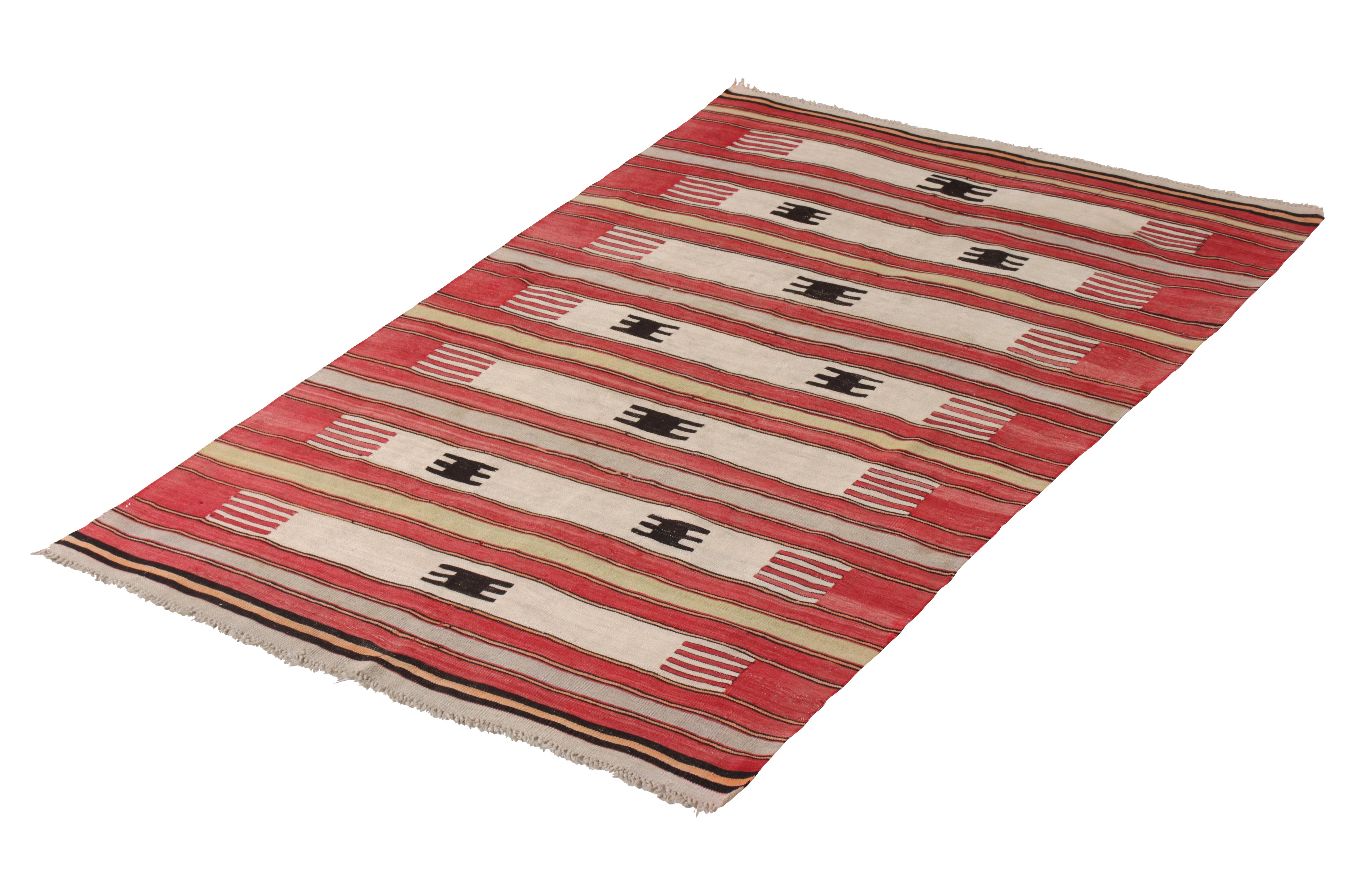 This Antique Turkish Kilim Rug, a handwoven treasure measuring 4'4