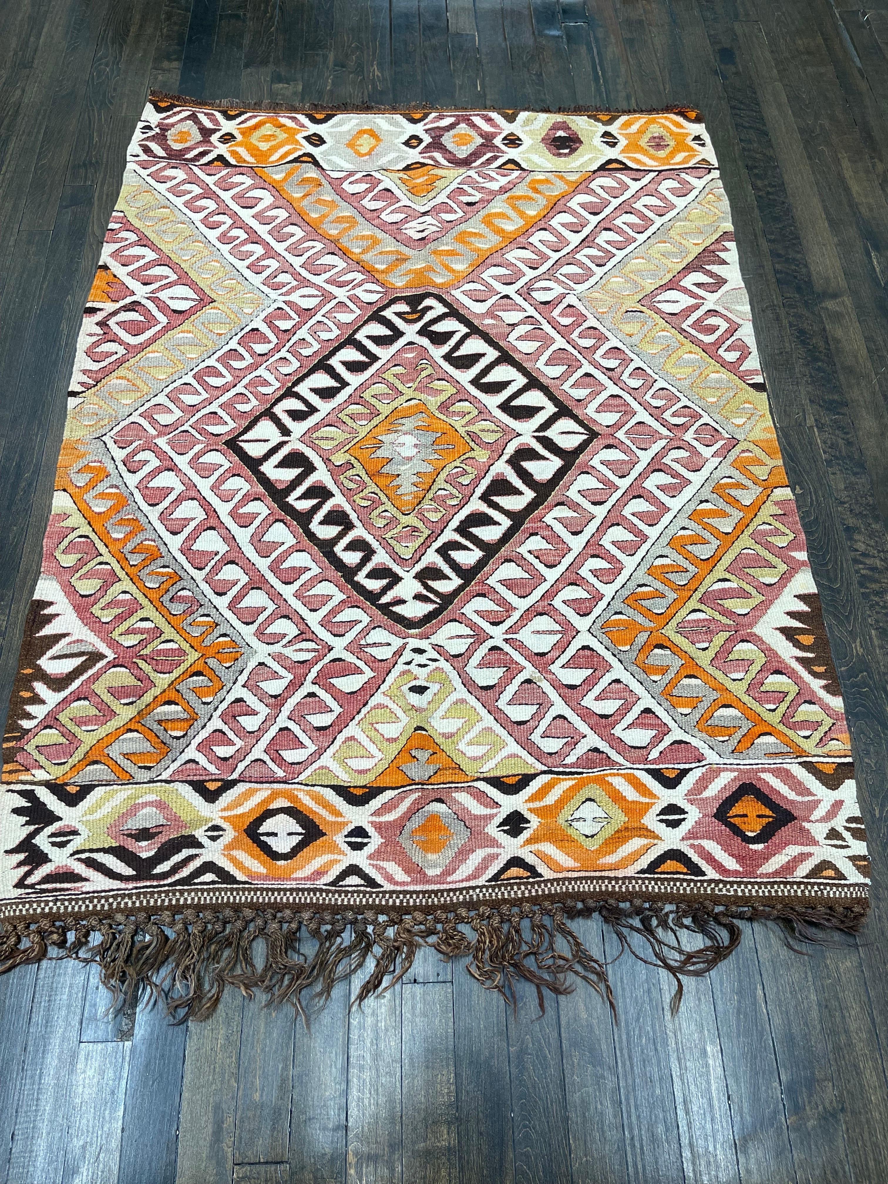 Stunning antique Turkish flat weave possibly made in Konya. Featuring clear crispy colors in orange red, and many shades of blue,brown,yellow,green and ivory. This kilm is perfect for wall hanging (a velcro strip has been sewn in across the width of