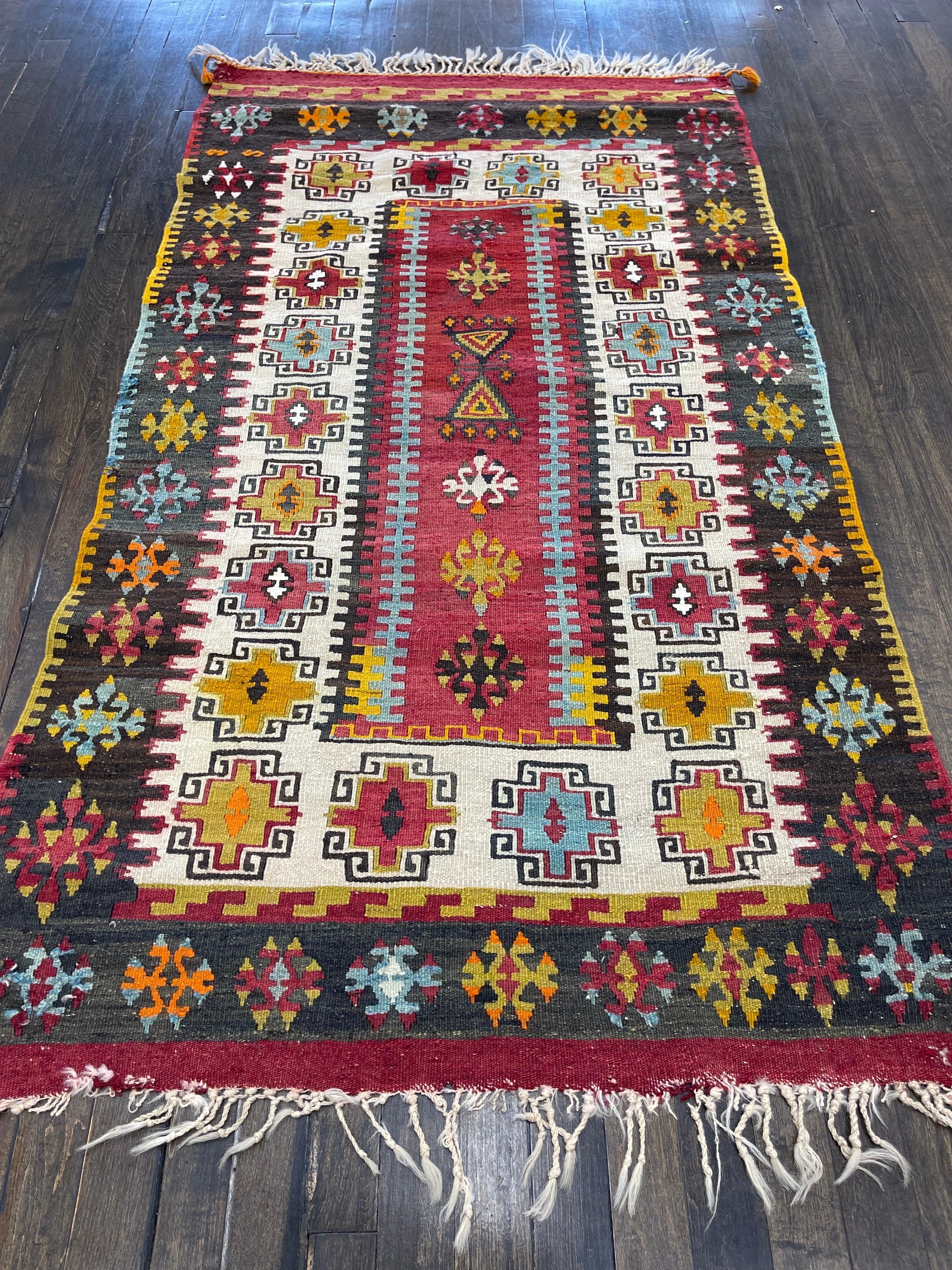 Stunning antique Turkish flatweave kilm, possibly made in Konya. Featuring clear crispy colors in orange, red, many shades of blues, brown, yellow, green and ivory. This kilm is perfect for wall hanging as a Velcro strip has been seen across the