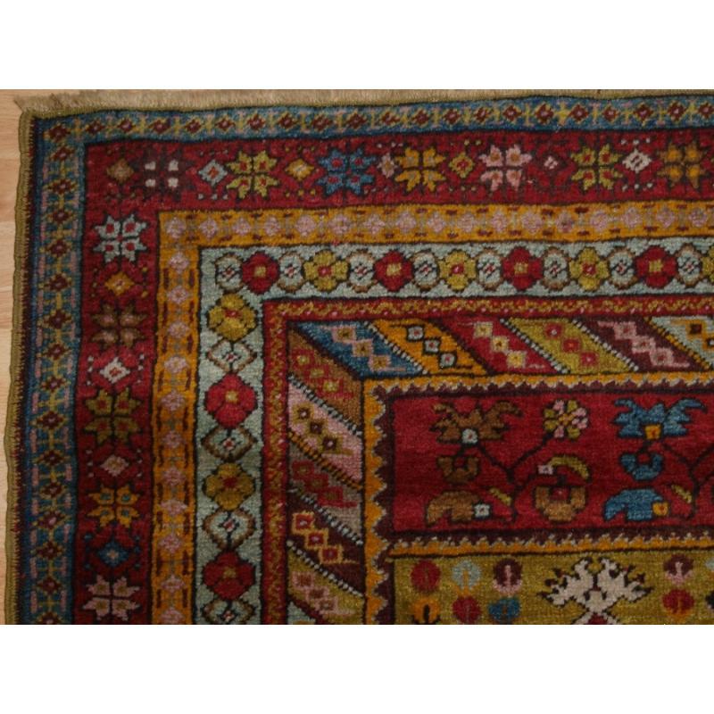 Antique Anatolian Kirsehir village prayer rug of traditional design
Circa 1920

The rug is of traditional village prayer design with the central panel in deep red, the upper and lower central panels are filled with carnation flowers The main border