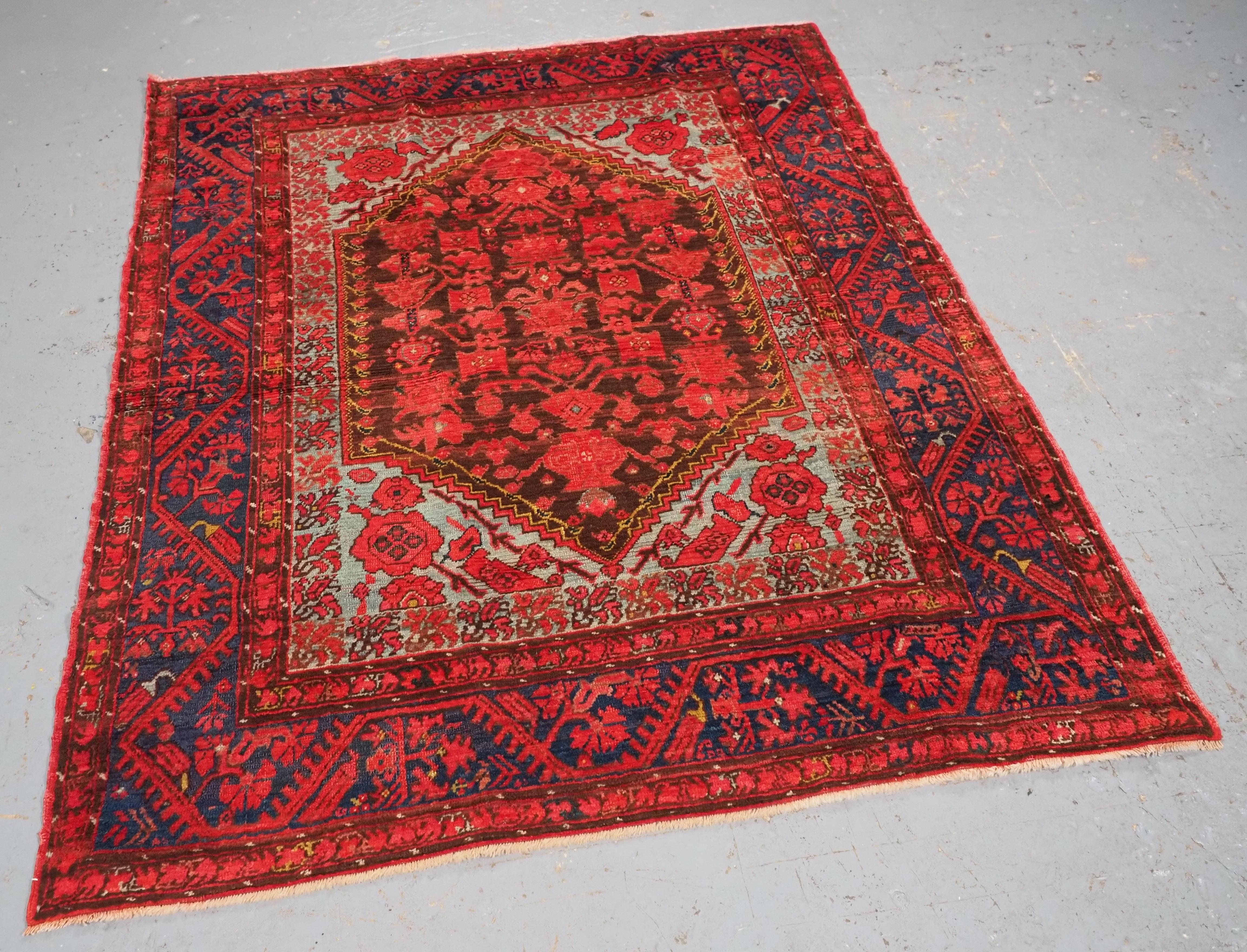 Size: 5ft 6in x 4ft 5in (168 x 135cm).

Antique Turkish Komurcu Kula rug of traditional desiign.

Circa 1900.

These scarce rugs are known as Komurcu rugs; this means coal or black, they are given the name due to the black / charcoal coloured back