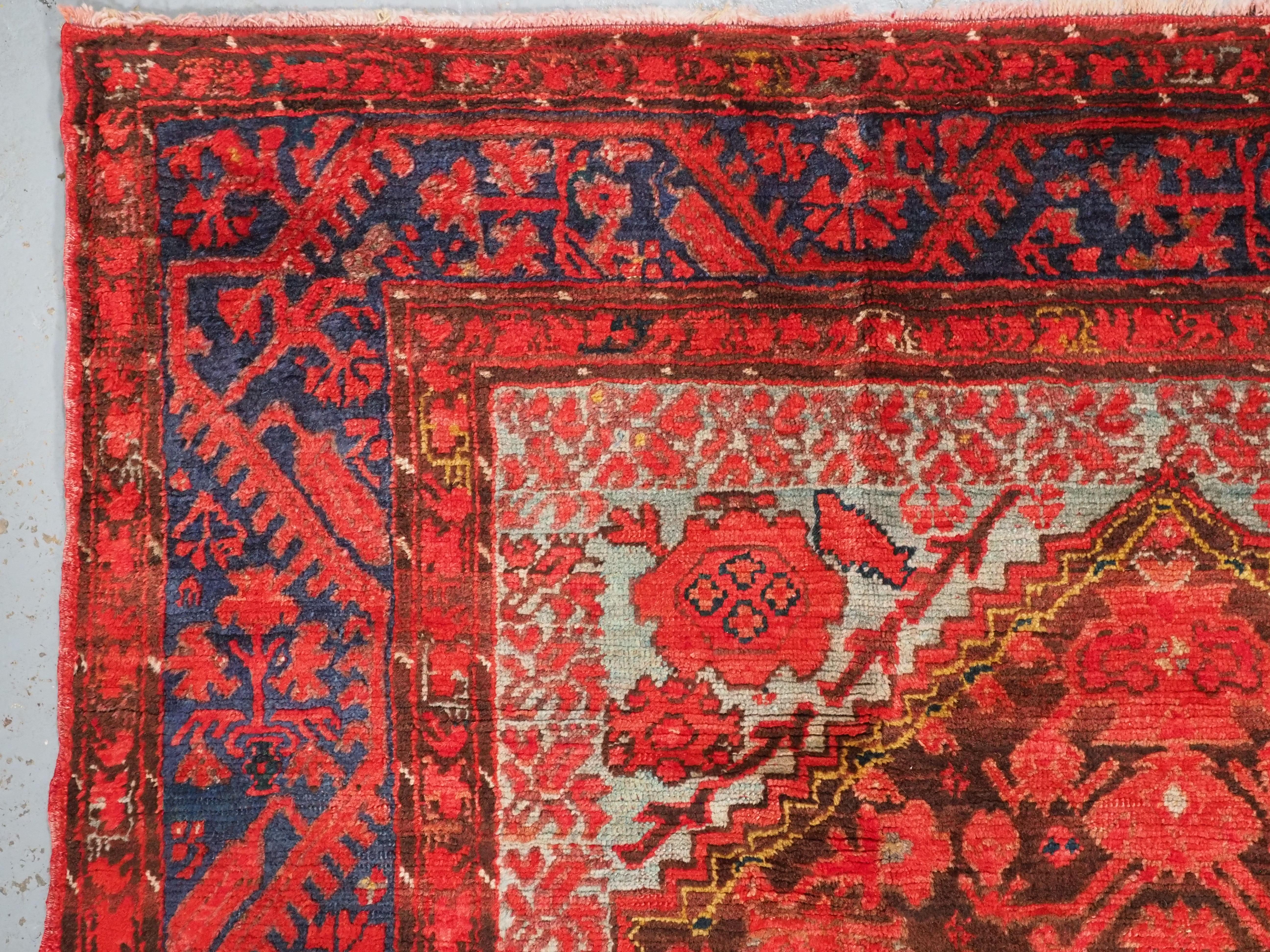 Wool  Antique Turkish Komurcu Kula rug of traditional desiign.  Circa 1900. For Sale