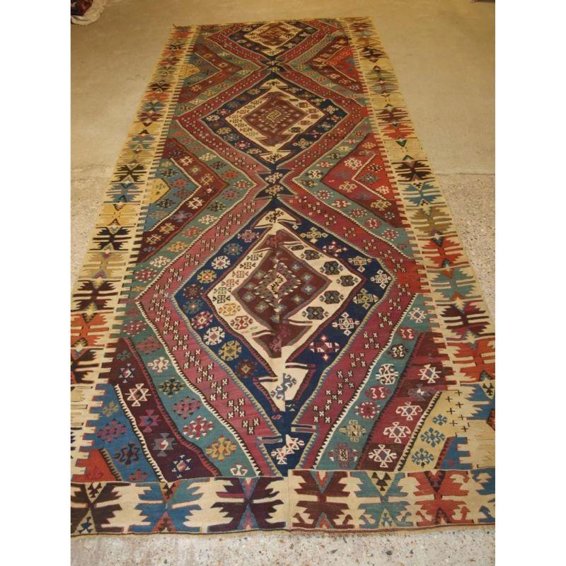Antique Turkish Malatya kilim with excellent traditional design and colour. This kilim was woven in two parts on a narrow loom and then sewn together, this is why the design and colour is very slightly different on each side. This adds to the visual