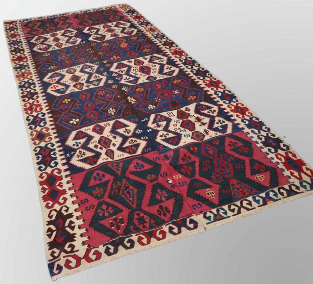 Antique Turkish Malatya kilim with excellent design and colour
Circa 1900

This kilim was woven in two parts on a narrow loom and then sewn together, this is why the design and colour is very slightly different on each side This adds to the visual