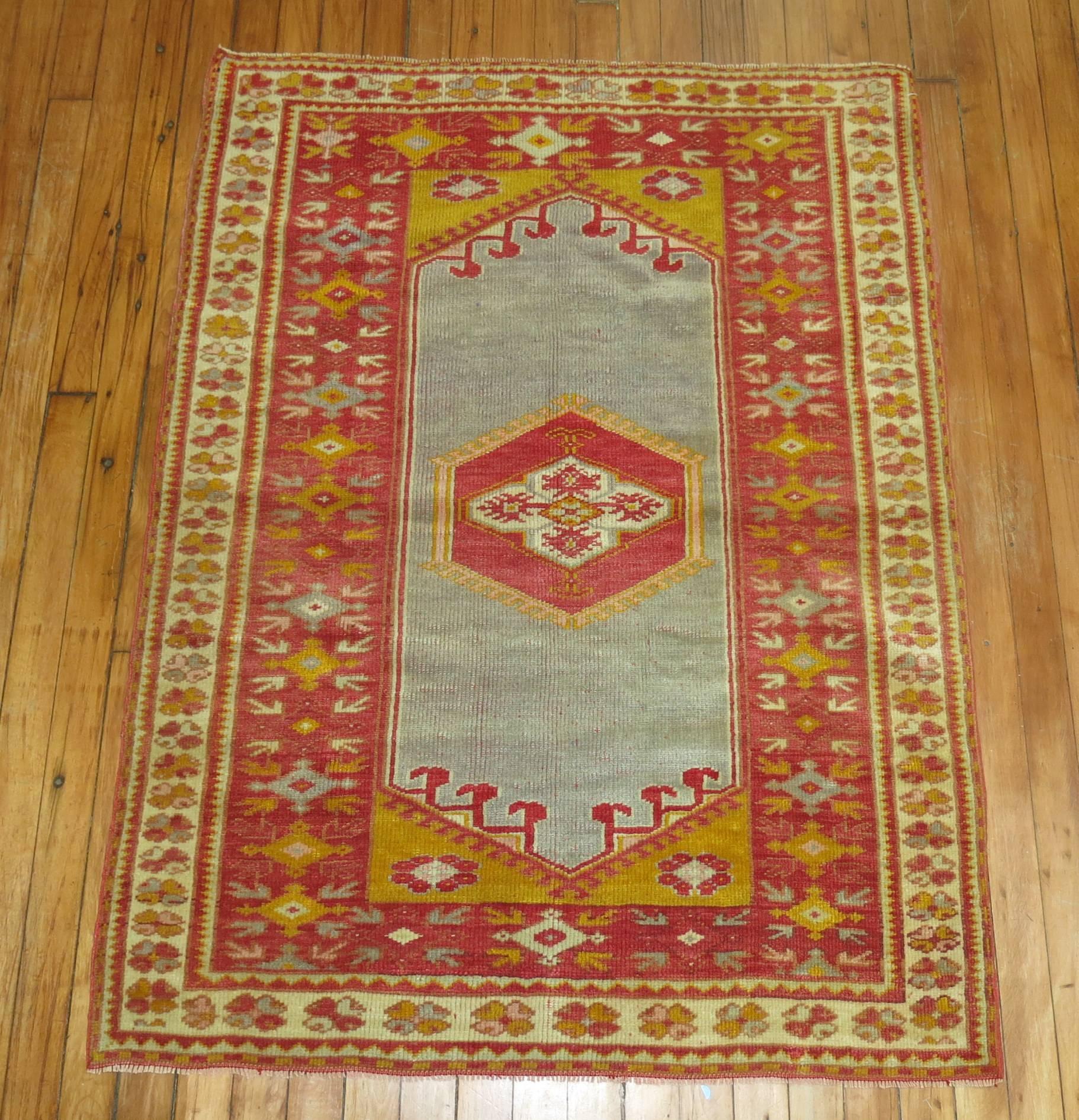 An early 20th century blue ground Turkish Melas rug.