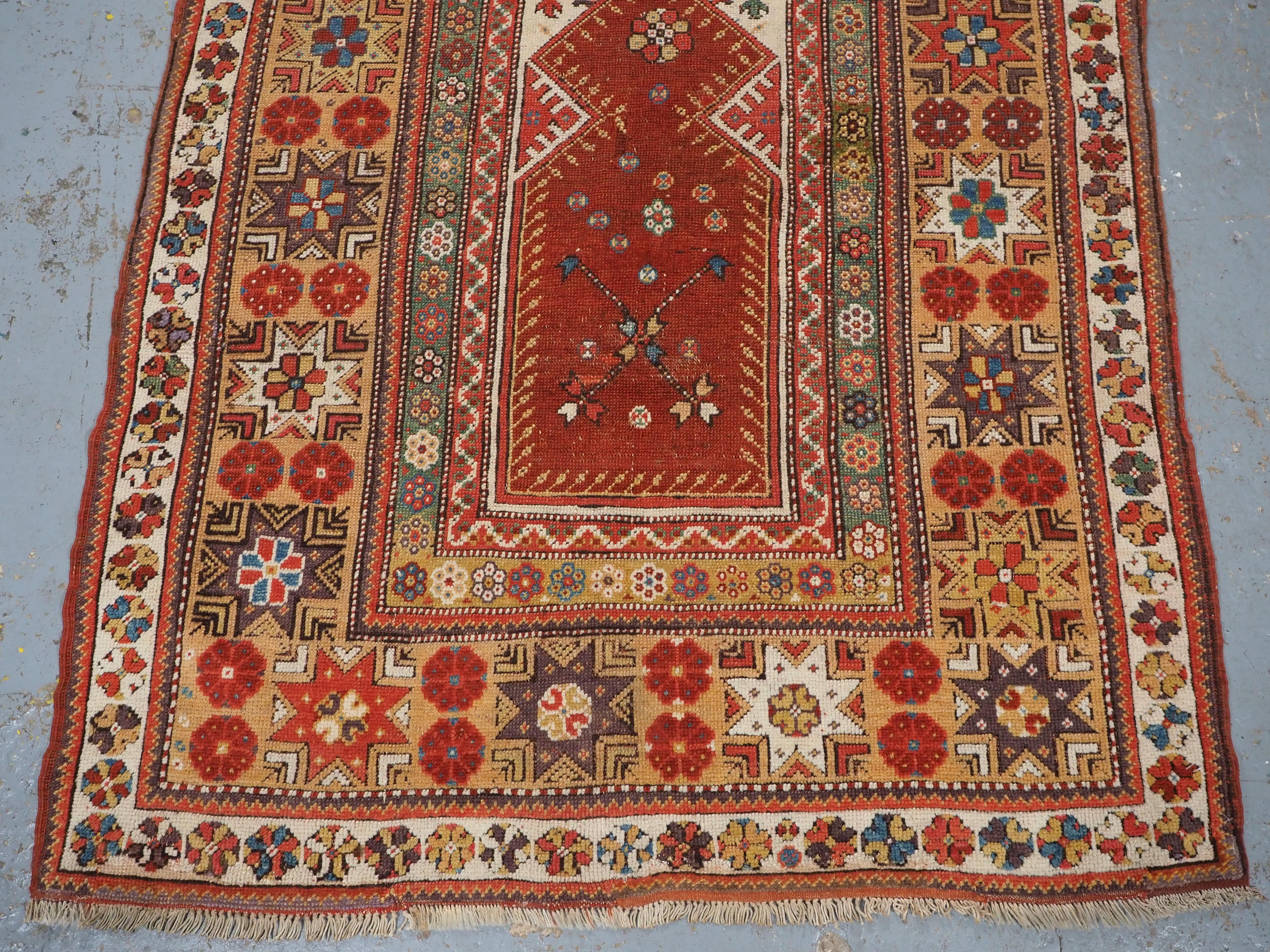Wool Antique Turkish Milas prayer rug of classic design, circa 1800-1825. For Sale
