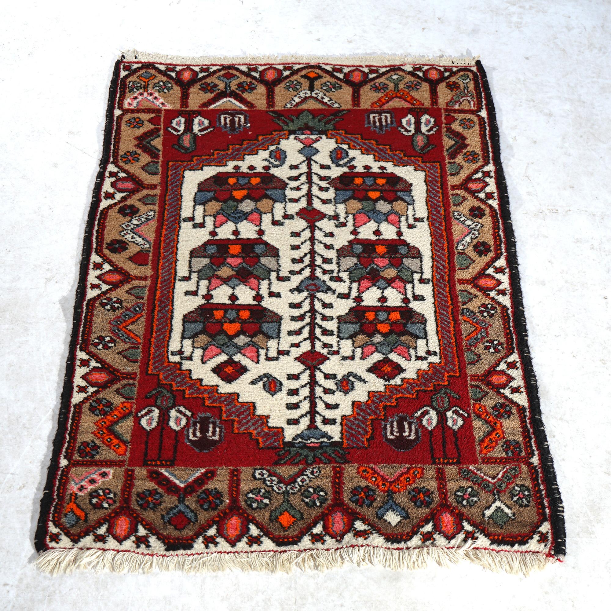 An antique Turkish oriental rug offers wool construction with central medallion having stylized floral elements, circa 1930

Measures - 49.5