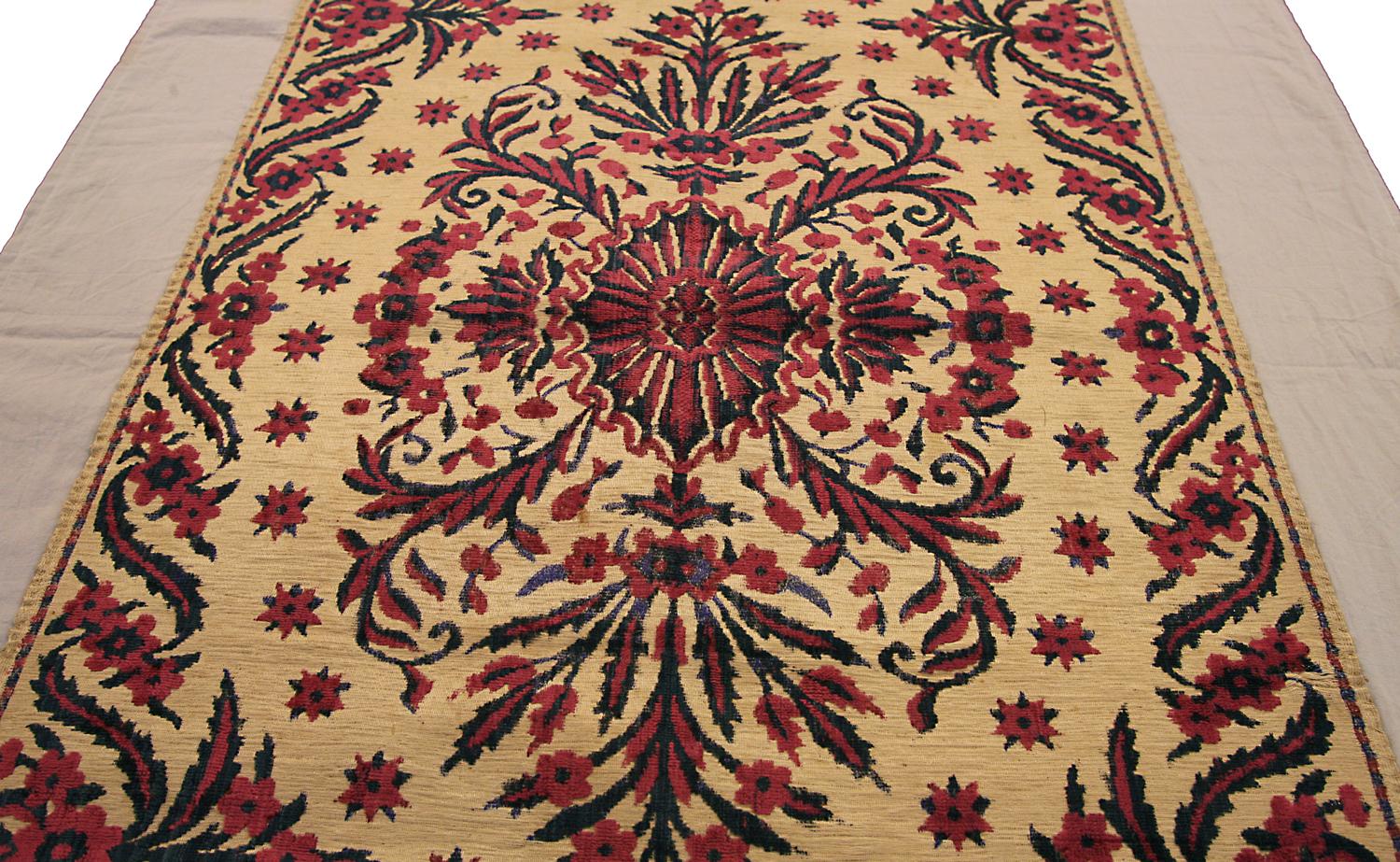 This is a rare antique ottoman textile woven in Turkey during the 19th century that measures 118 x 55CM in size. Its design revolves around its floral center medallion set on a beige background color and surrounded by star motifs spread throughout