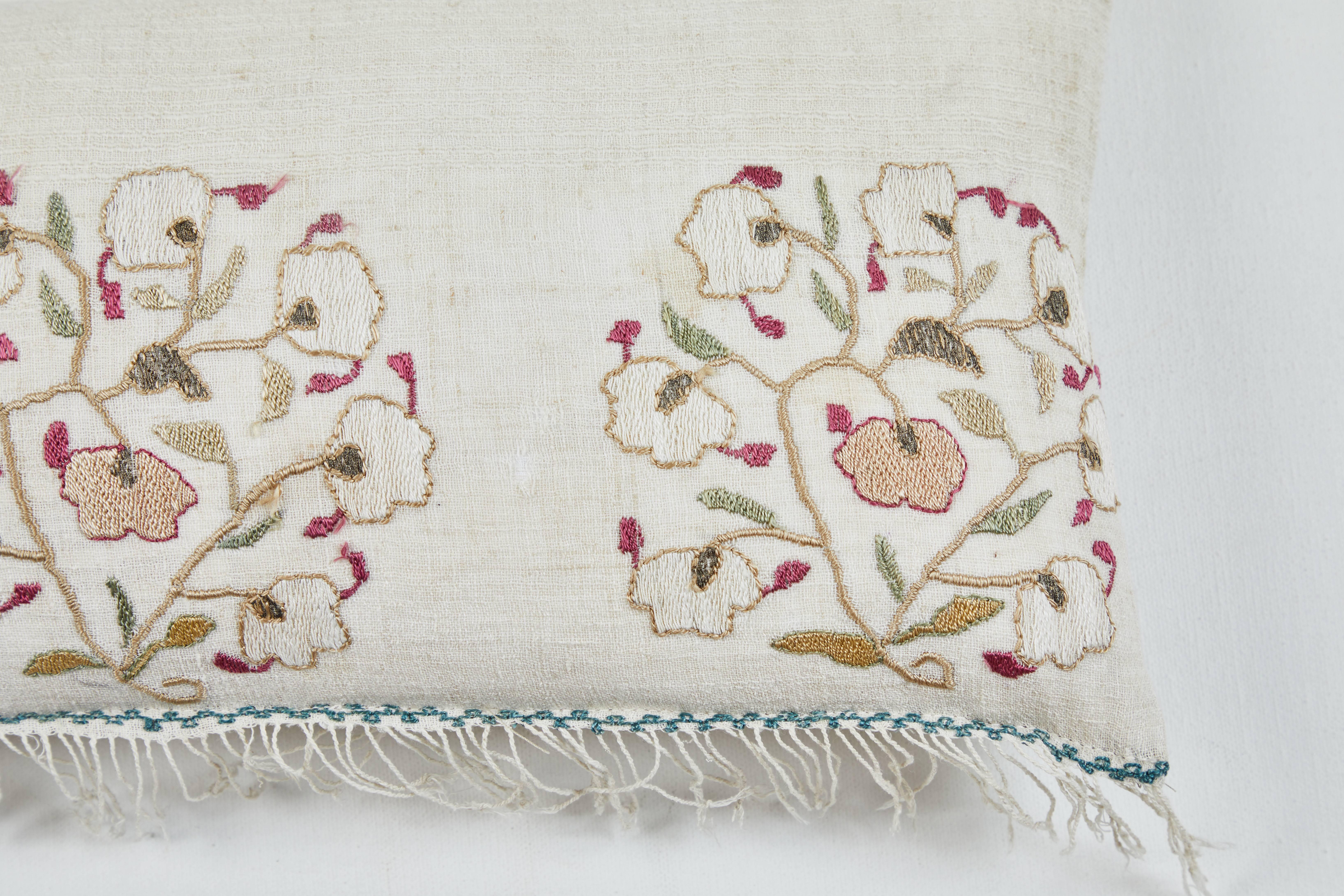 Intricate silk embroidery in pink, red, green, gold, ivory and blue on hand woven linen. Natural linen back. Feather and down fill. Invisible zipper.

   