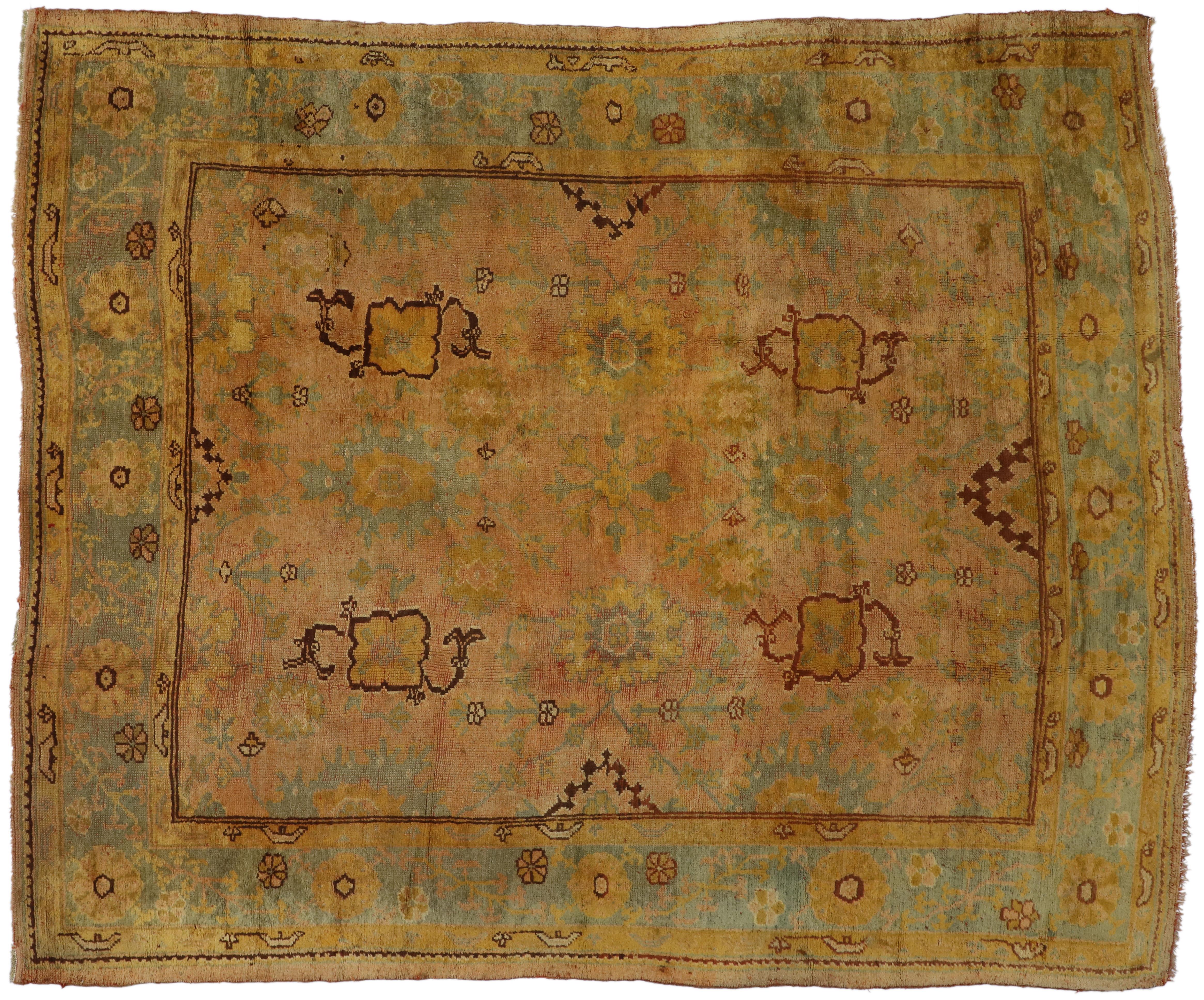 73987 Antique Turkish Oushak Area Rug with French Provincial and Louis XIV Style. This hand-knotted wool antique Turkish Oushak rug features an all-over geometric pattern composed of Harshang-style motifs, blooming palmettes, leafy tendrils, organic