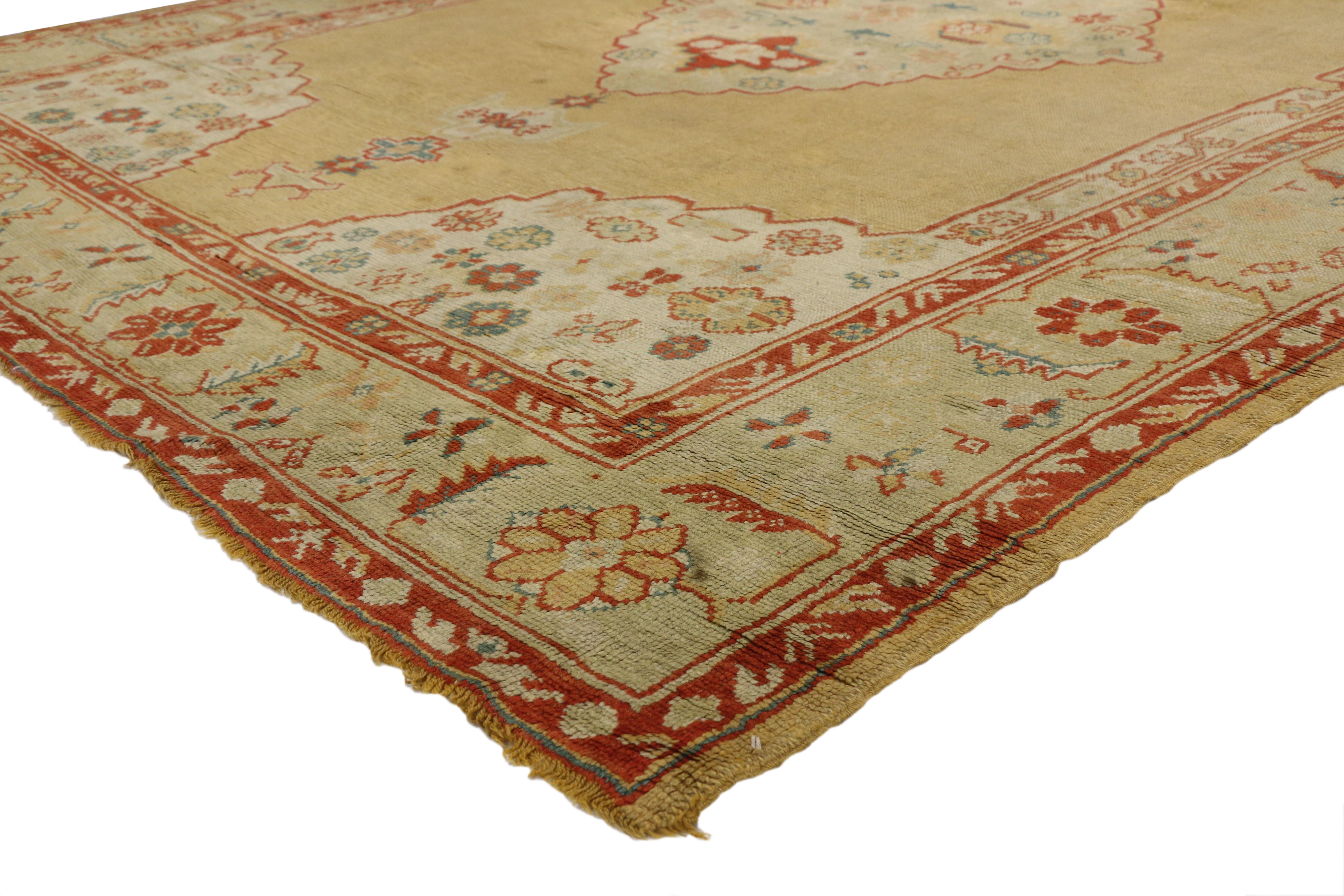 74032 Antique Turkish Oushak Rug, 09'03 x 11'10. In the heart of this antique Turkish Oushak rug lies a symbolic medallion, adorned with Anatolian motifs that speak to ancient traditions and timeless wisdom. Against a backdrop of golden saffron, the