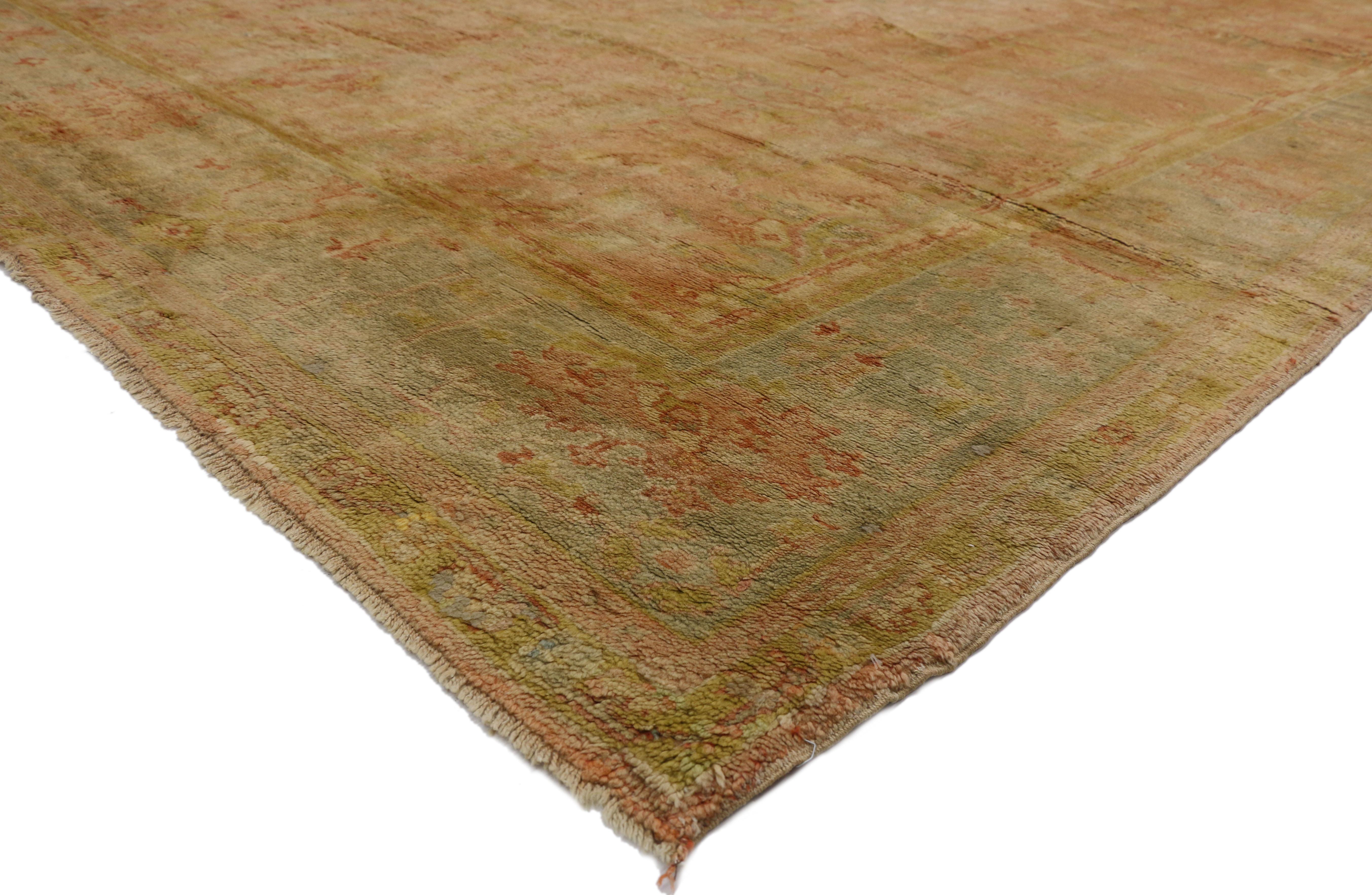 73159 Antique Turkish Oushak Rug, 10'01 x 13'09.
Spanish eclectic meets sunbaked elegance in this hand knotted wool antique Turkish Oushak rug. The intrinsic botanical design and soft spice-tone colors woven into this piece work together creating a