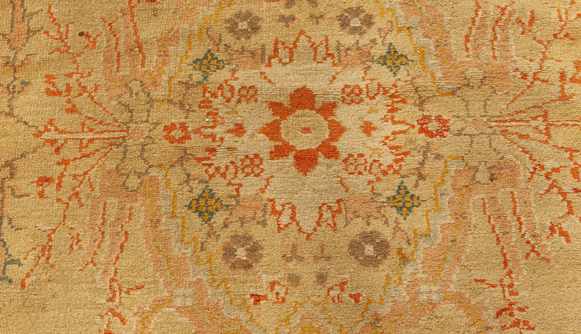 Ancien tapis botanique turc Oushak beige
Taille : 11'5