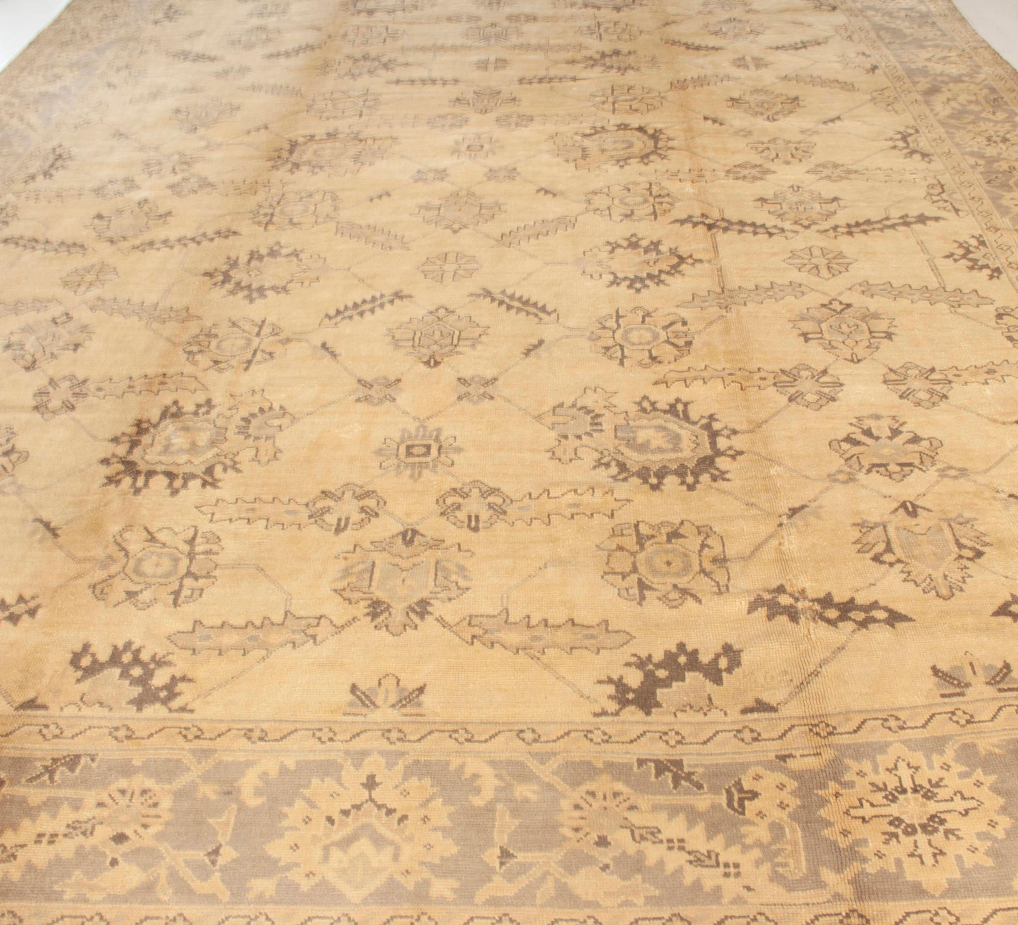20th Century Antique Turkish Oushak Handwoven Wool Rug For Sale