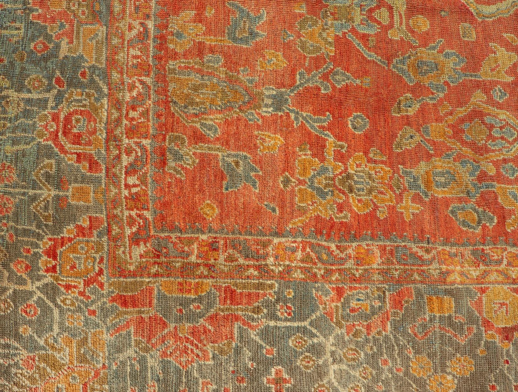 Early 20th Century Antique Turkish Oushak Rug in Terracotta With All-Over Flower, Leaves and Vines  For Sale