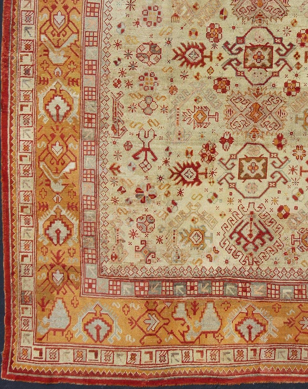 Antique Turkish Oushak Carpet With All-Over Design In Red, Taupe, and Orange. Keivan Woven Arts; rug G-0901, Country of Origin: Turkey Type: Antique Oushak Design: Floral, Sub-Geometric, All-Over.
Measures: 10'5 x 12'5.
This impressive Oushak carpet