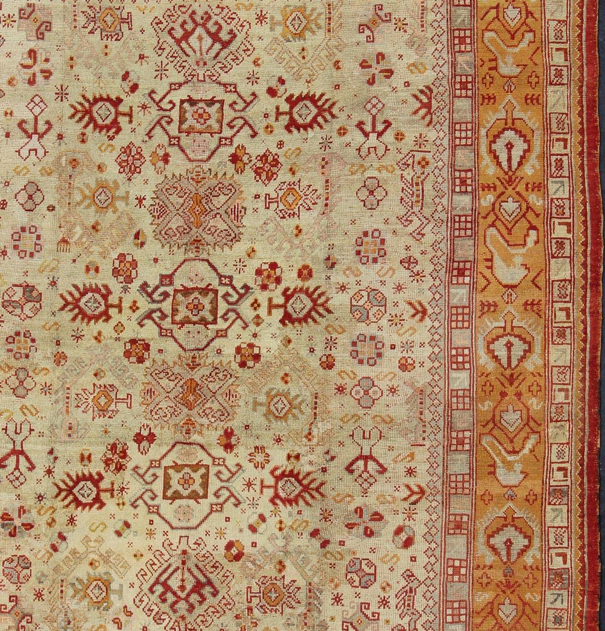 Antique Turkish Oushak Carpet With All-Over Design In Red, Taupe, and Orange In Excellent Condition For Sale In Atlanta, GA