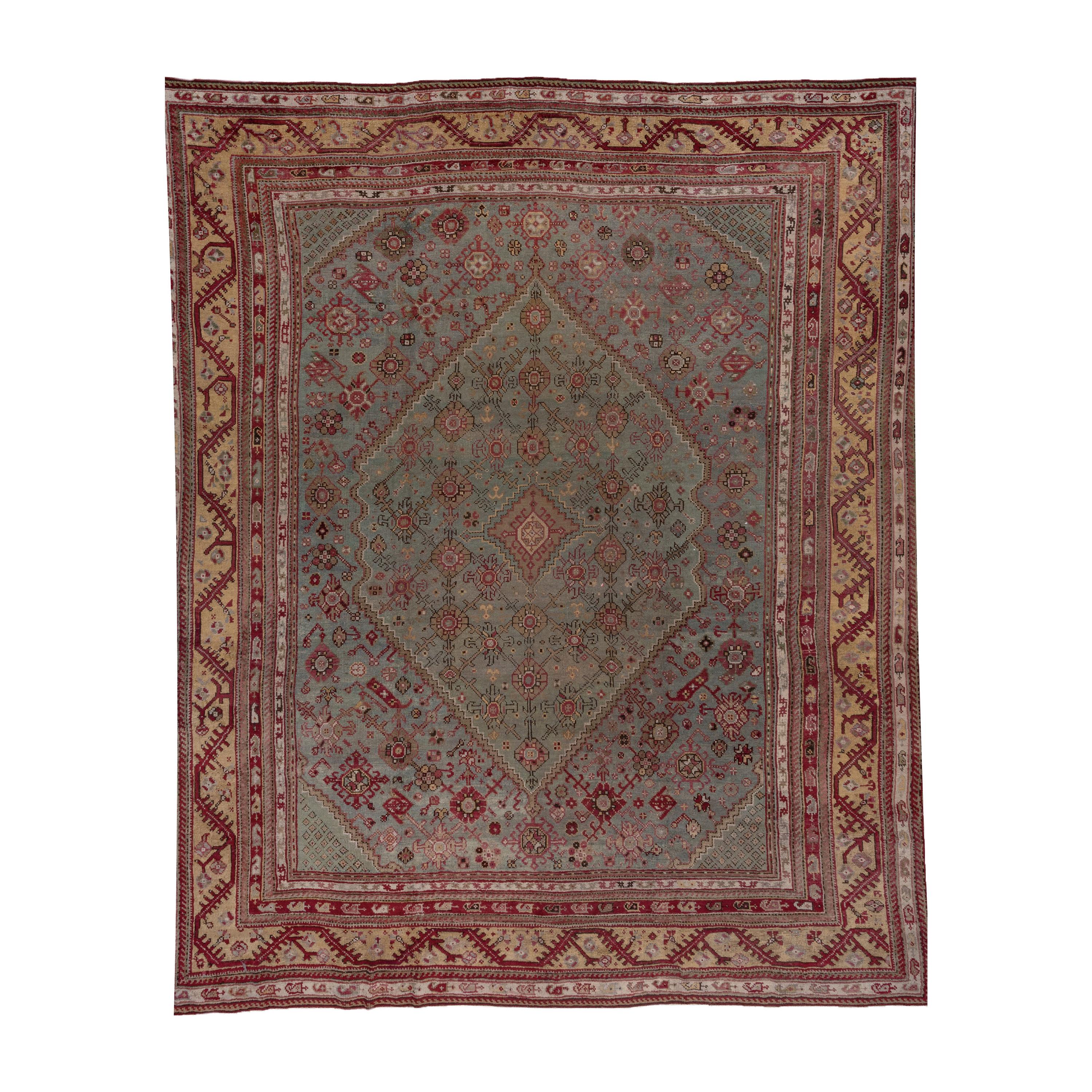 Antique Turkish Oushak Carpet, Light Blue Field, Citron Border & Plum Accents For Sale
