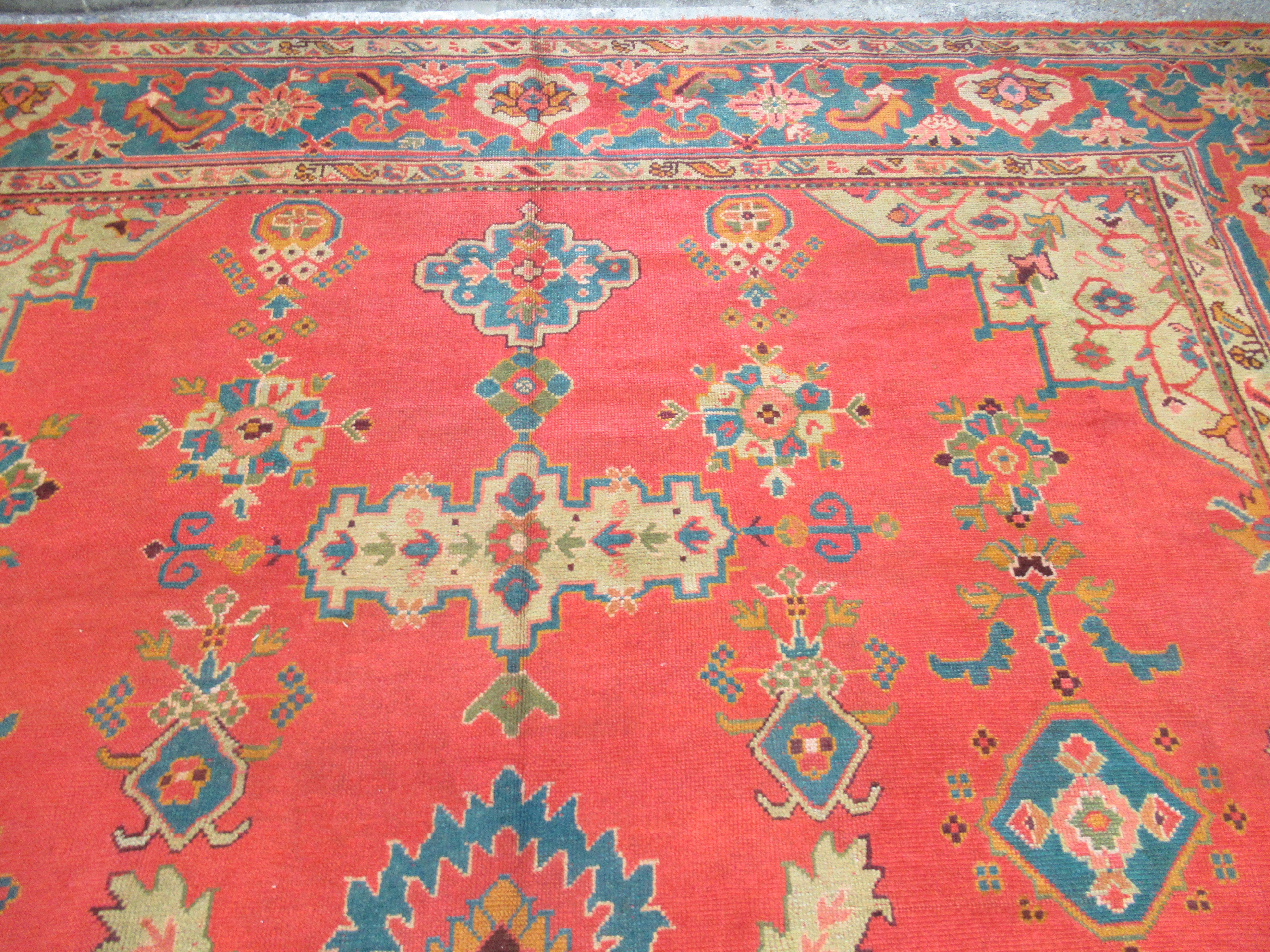 Hand-Woven Antique Turkish Oushak Carpet of Outstanding Colour with a Small Medallion