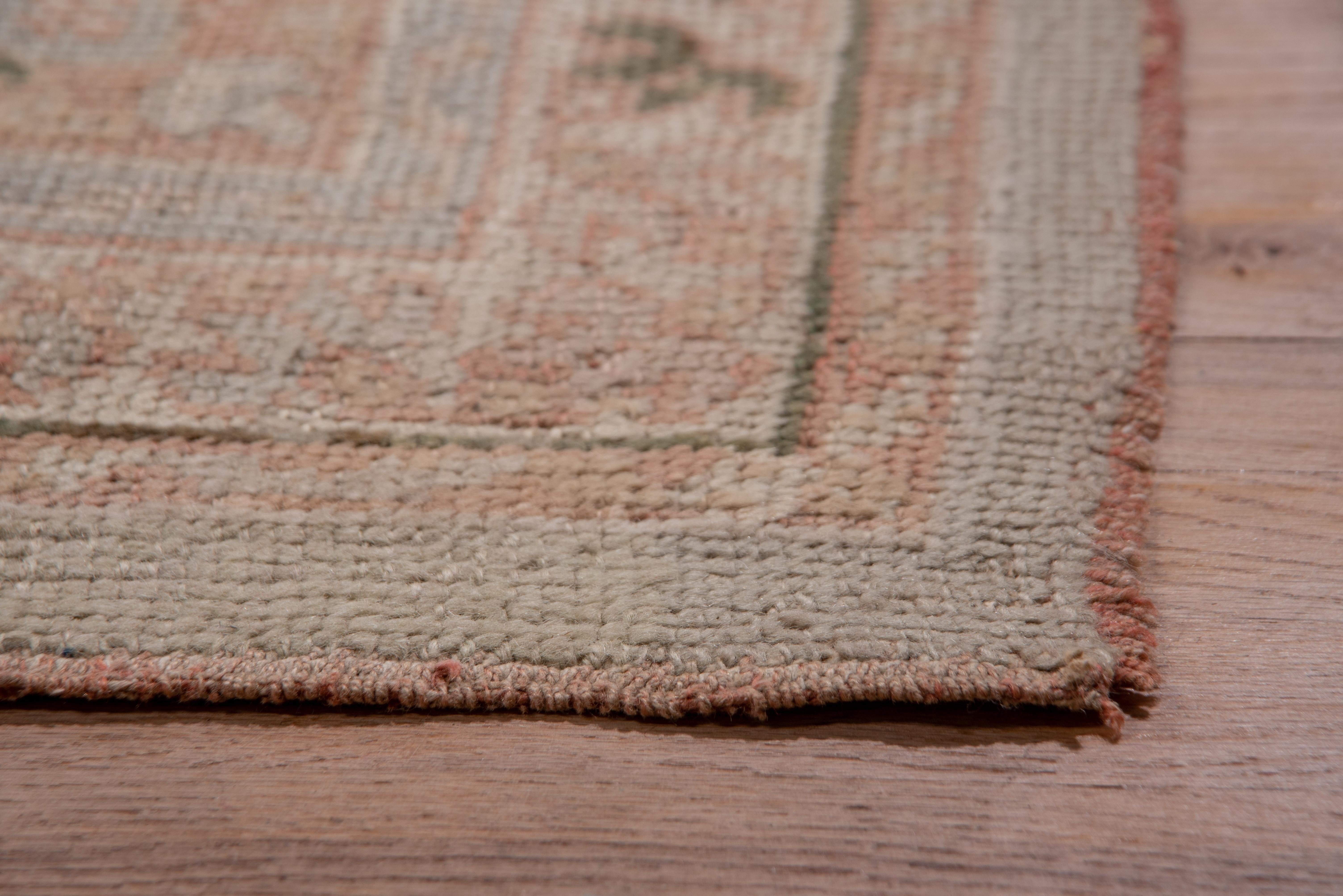 Hand-Knotted Antique Turkish Oushak Carpet, Soft Gray Field & Light Pink Borders, circa 1920s For Sale