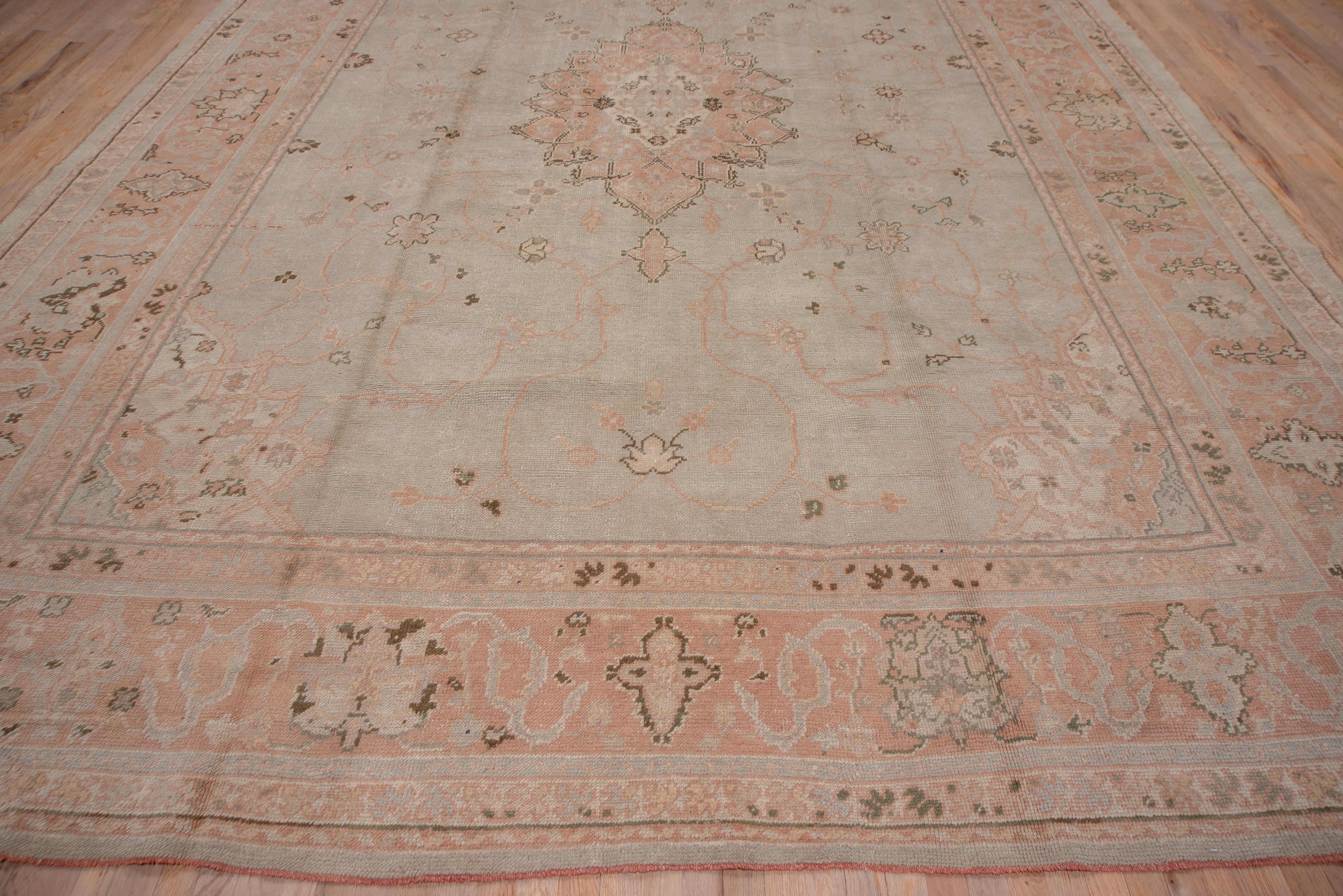 Early 20th Century Antique Turkish Oushak Carpet, Soft Gray Field & Light Pink Borders, circa 1920s For Sale