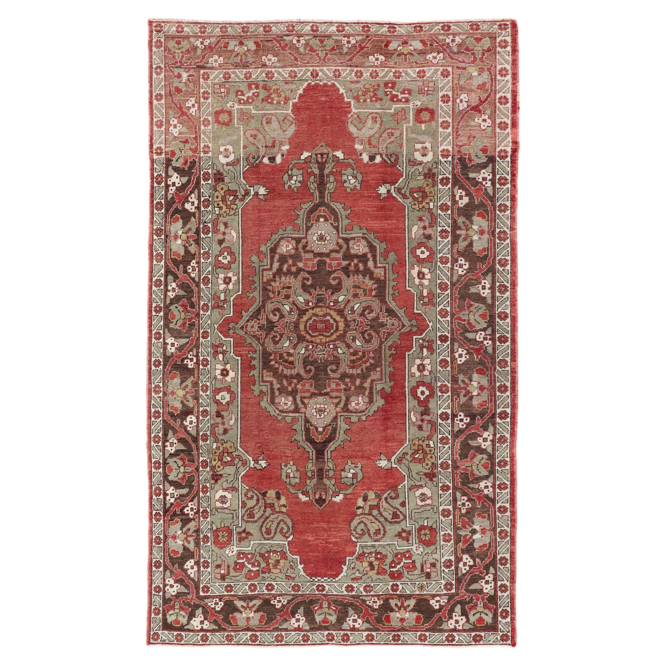 Antique Turkish Oushak Carpet with Medallion in Soft Red, Green and Brown For Sale