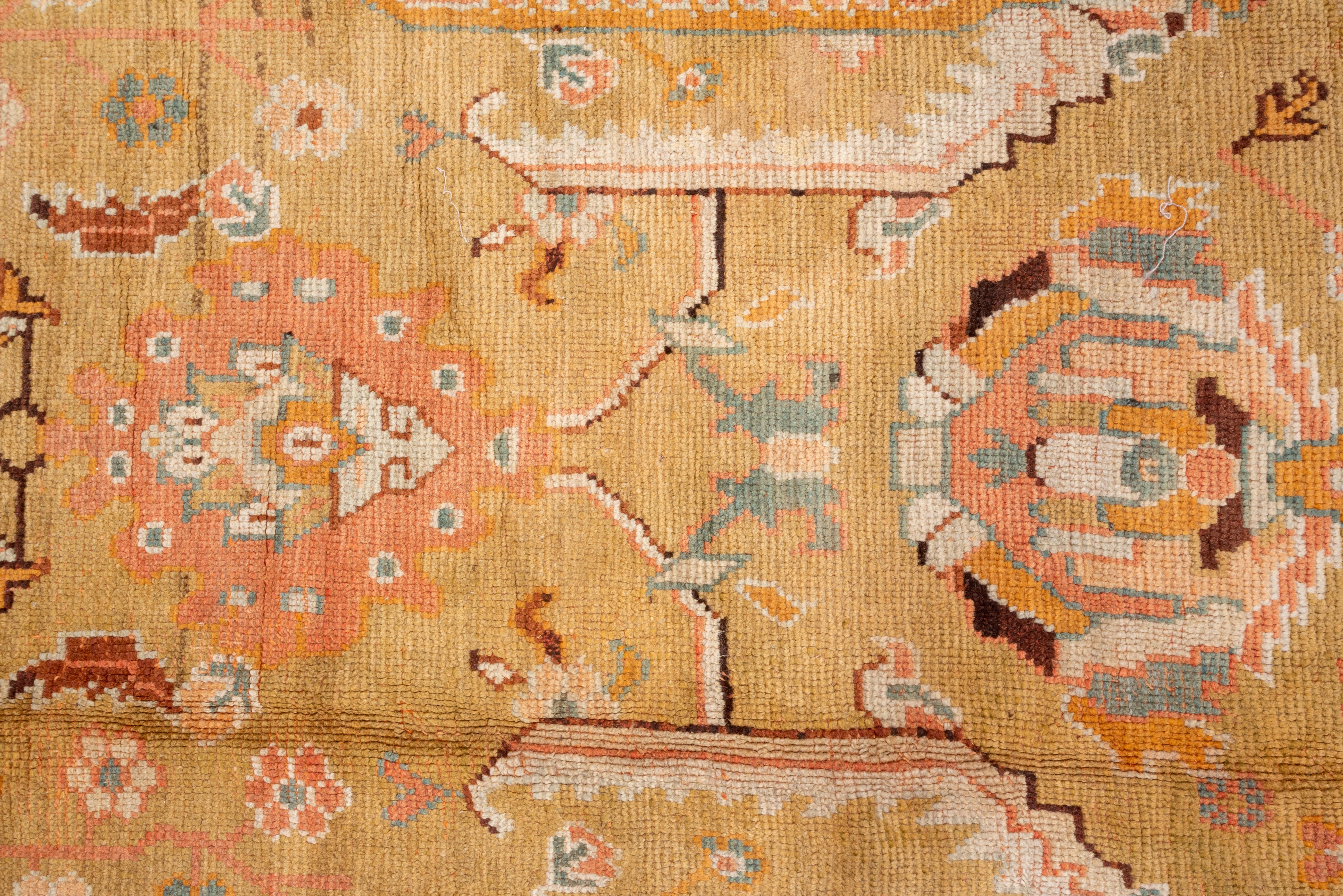 Wool Antique Turkish Oushak Carpet, Yellow Field, Pink Borders, Colorful Border For Sale