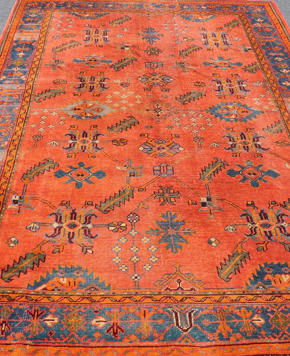 Antique Turkish Oushak Colorful Rug With All-Over Design In Salmon and Blue's.  Keivan Woven Arts; rug EN-141817, Country of Origin: Turkey Type: Antique Oushak Design: Floral, Sub-Geometric, All-Over.
Measures: 7'9 x 12'4.

Vibrant flowers and